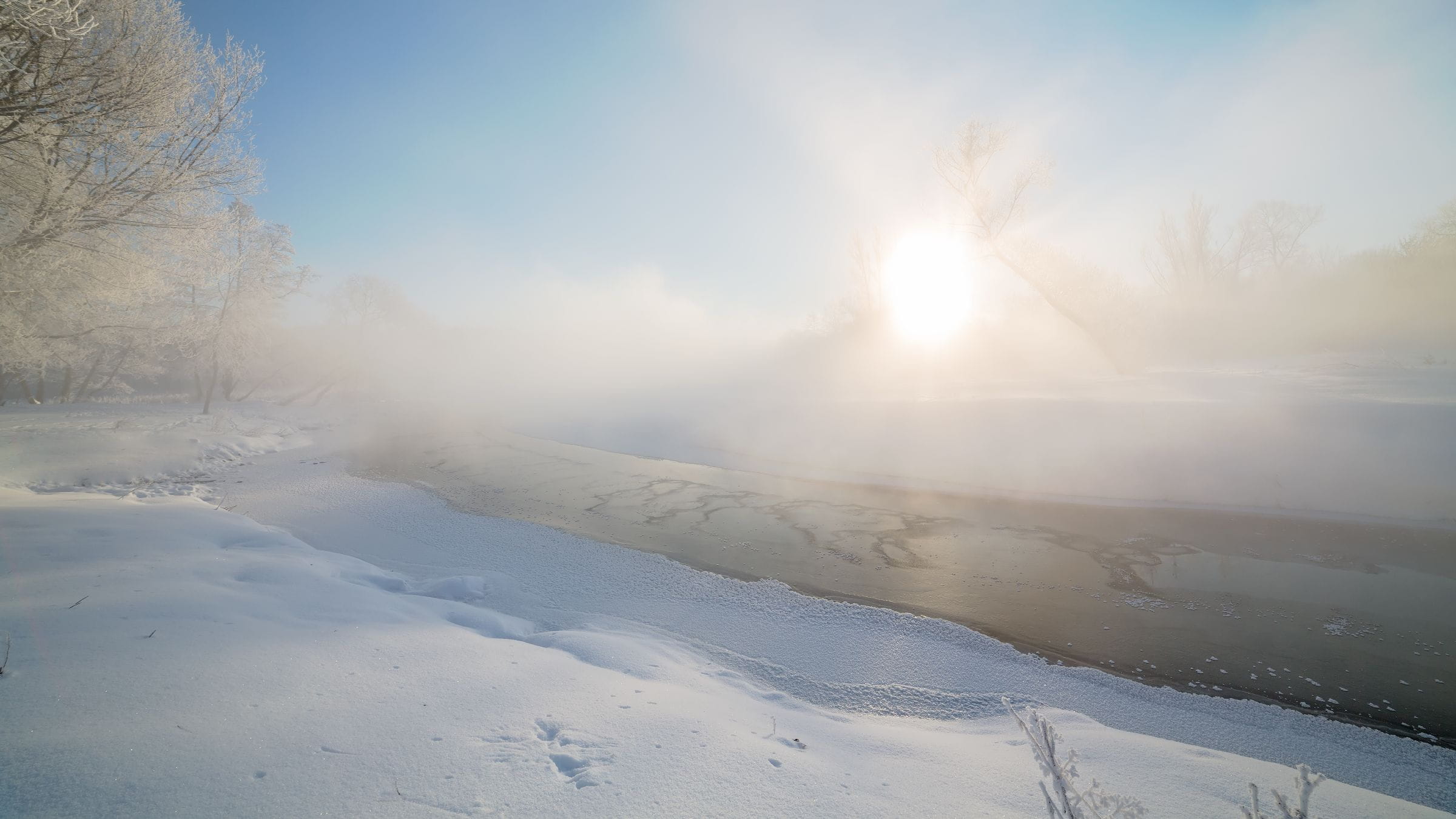 Bright sun shining over snow