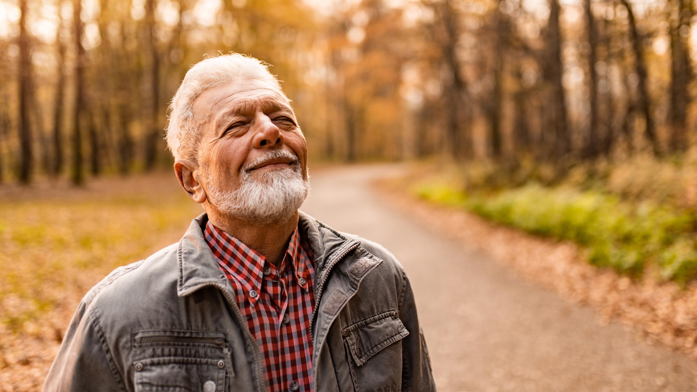 Senior man enjoying a walk in a park