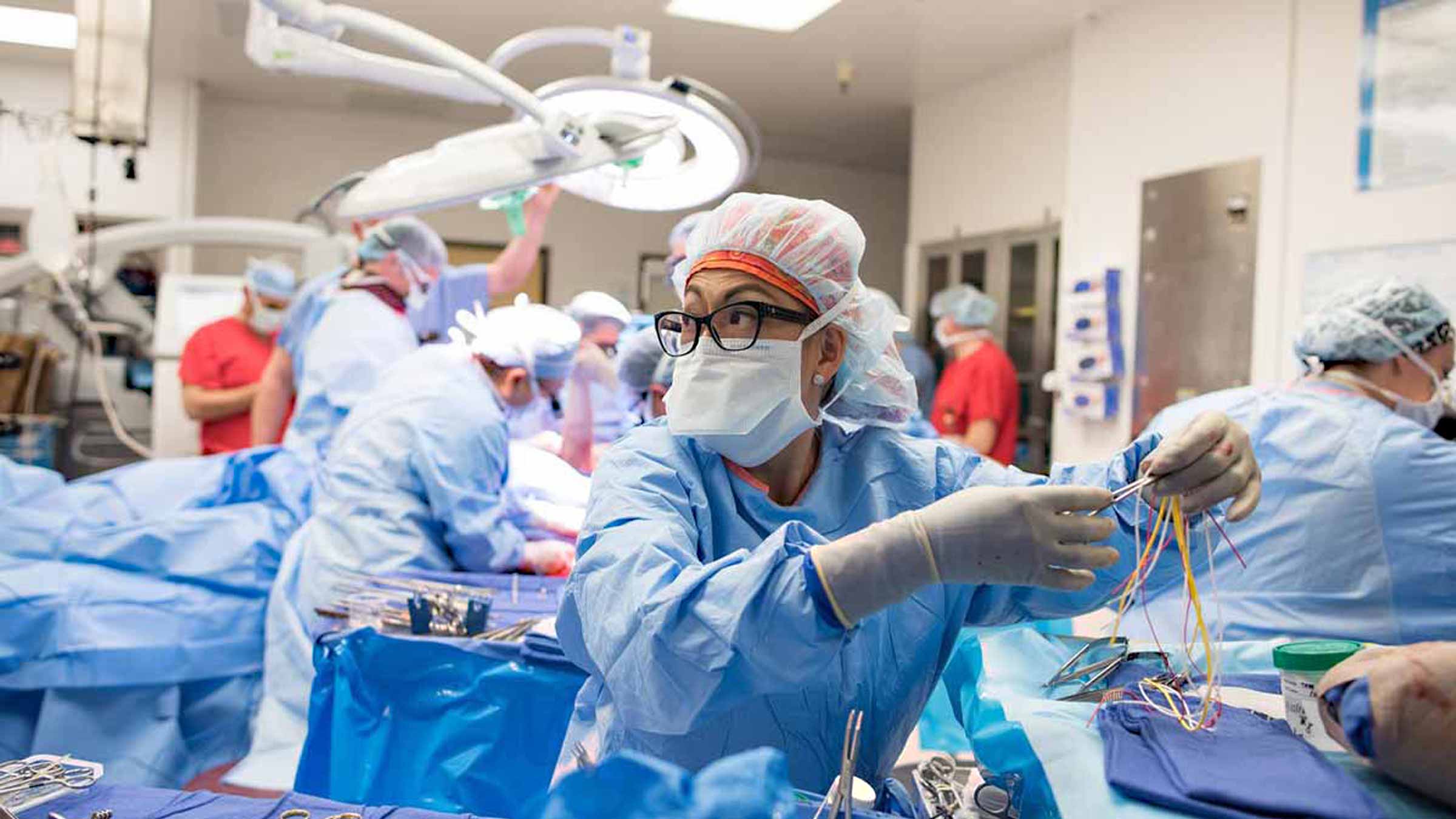 Surgeons preparing for emergency surgery in operation room