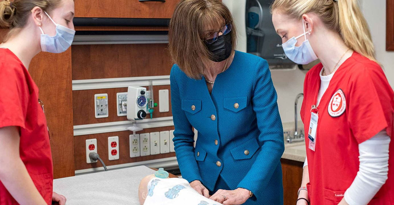 Andrea Pfeifel training residents in masks