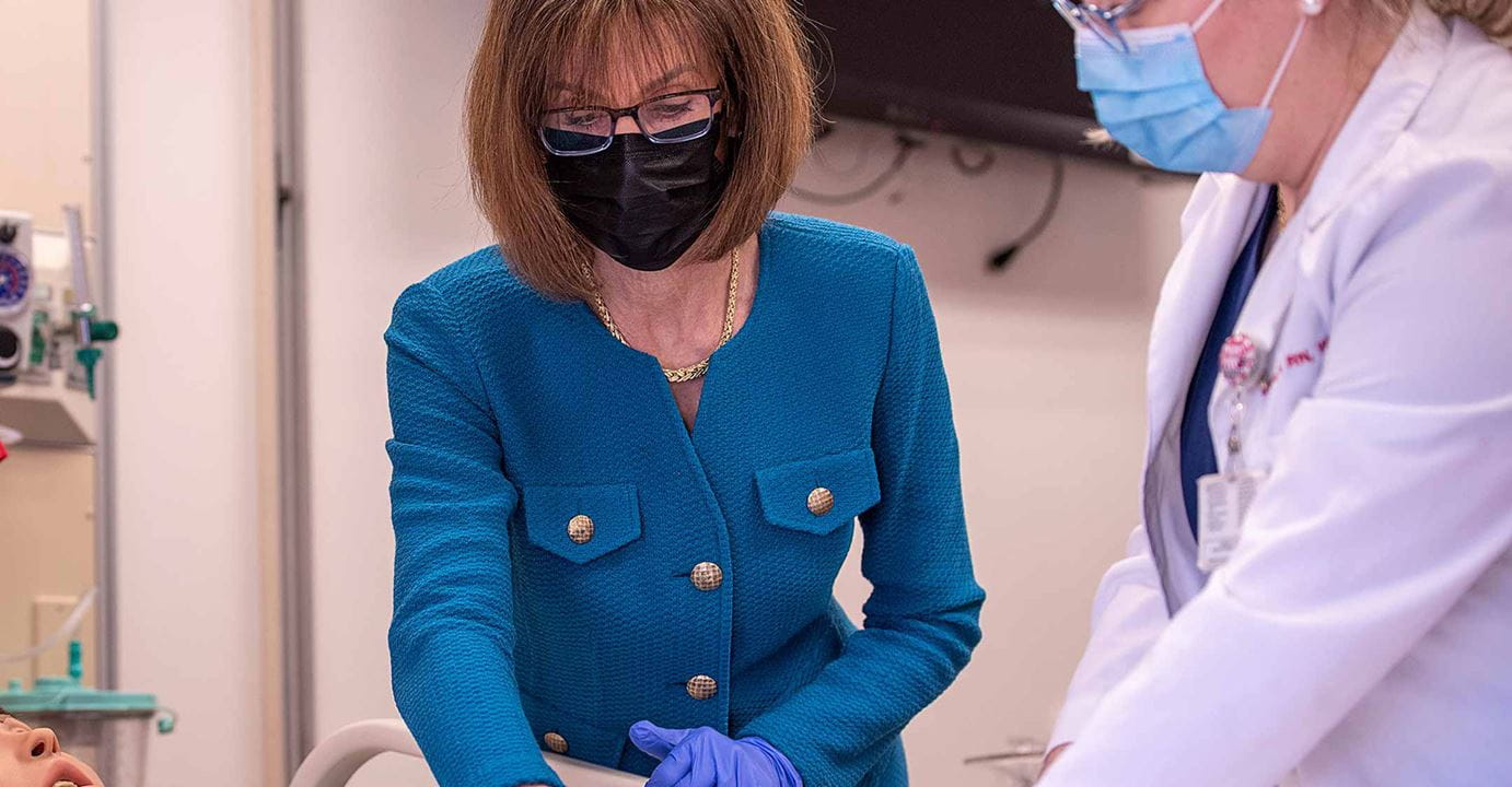 Andrea Pfeifel with doctor wearing masks
