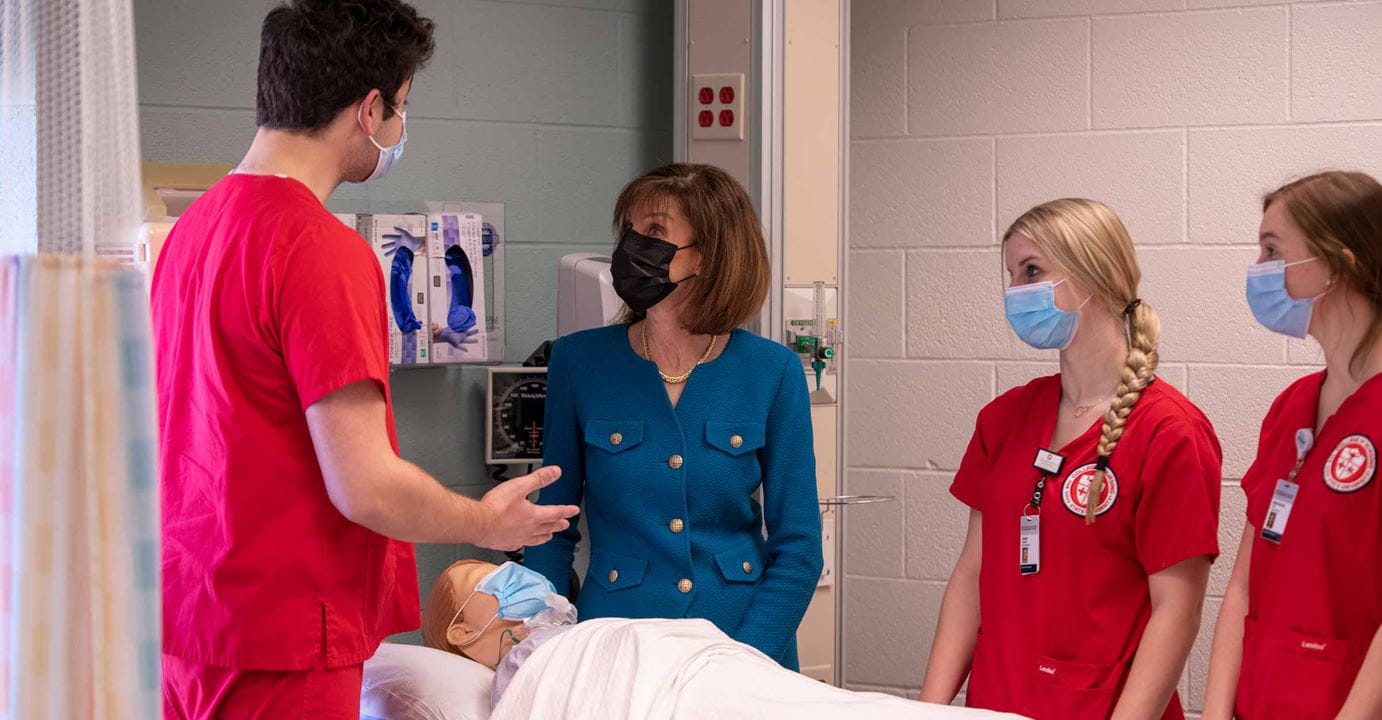 Andrea Pfeifel with residents training wearing masks