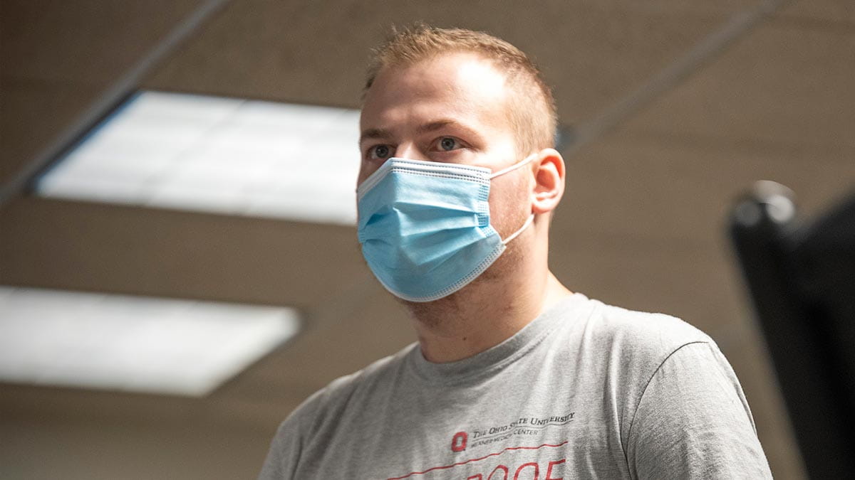 Kodi Elder, a recovering COVID-19 patient and lung transplant recipient, walking on a treadmill