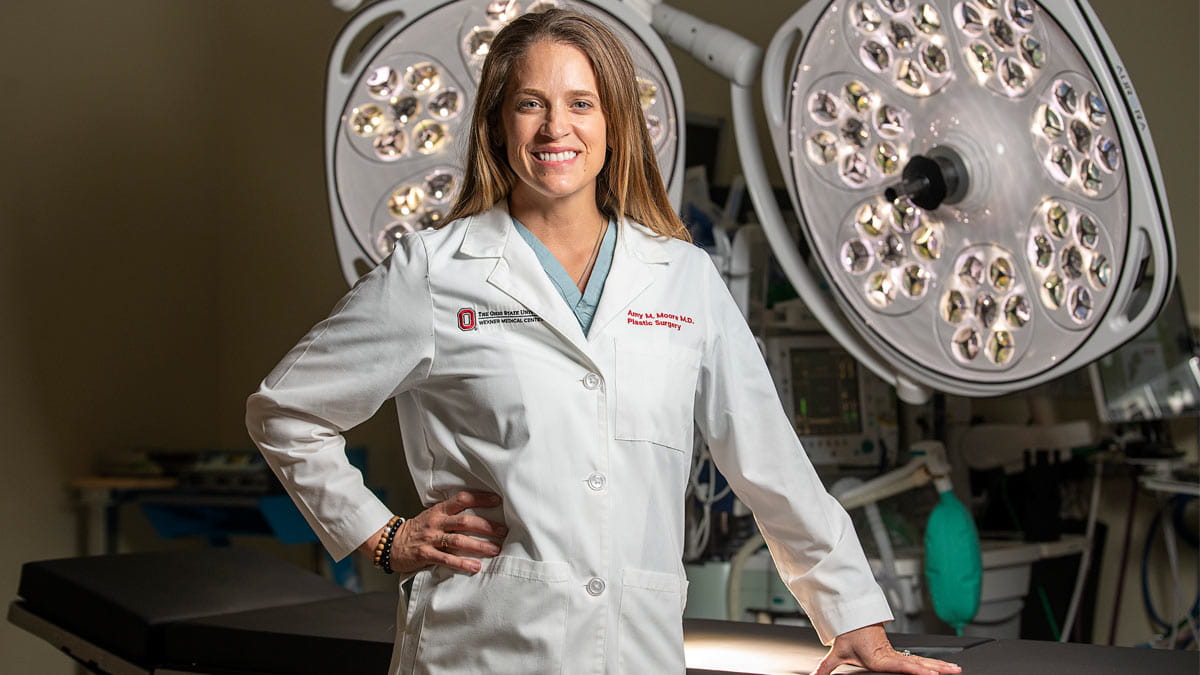 Plastic surgeon, Amy Moore, standing in a surgical suite