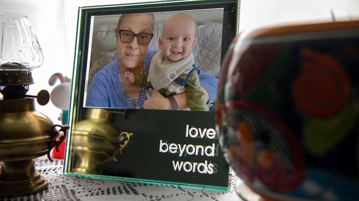 A framed photo of Raven's mother with baby Lorenzo