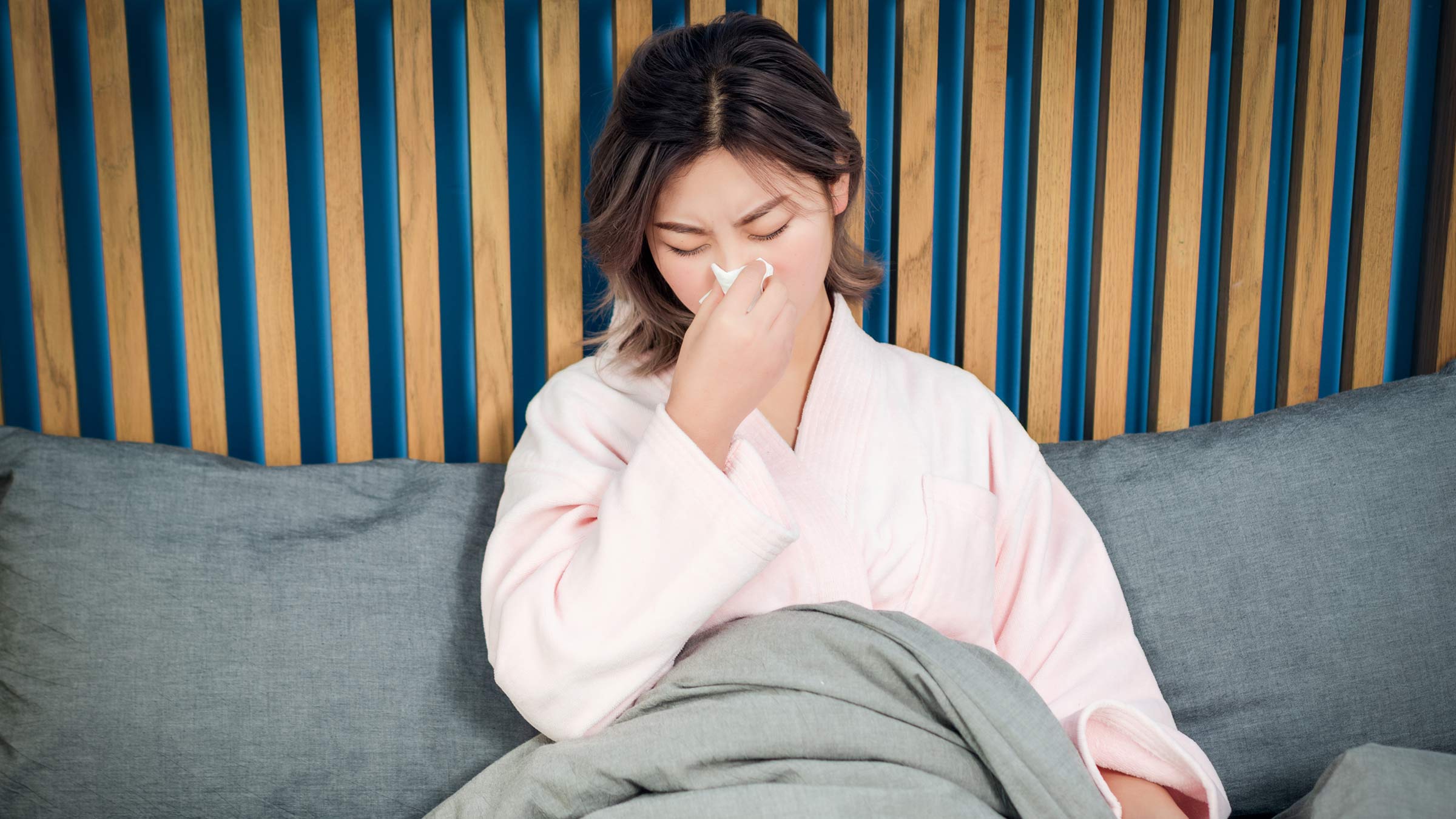 Woman suffering from flu symptoms