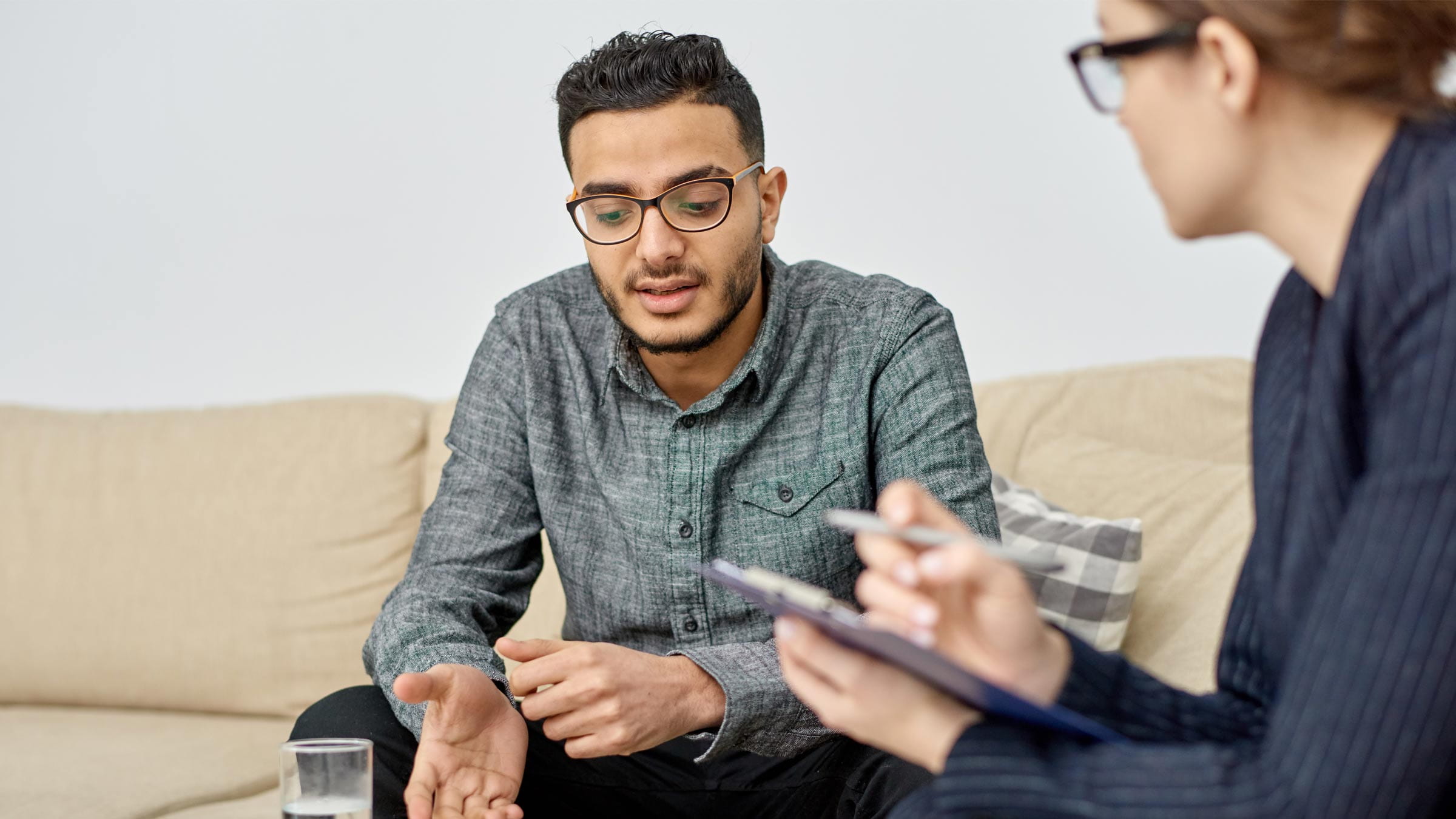 Young man talking to a mental health professional