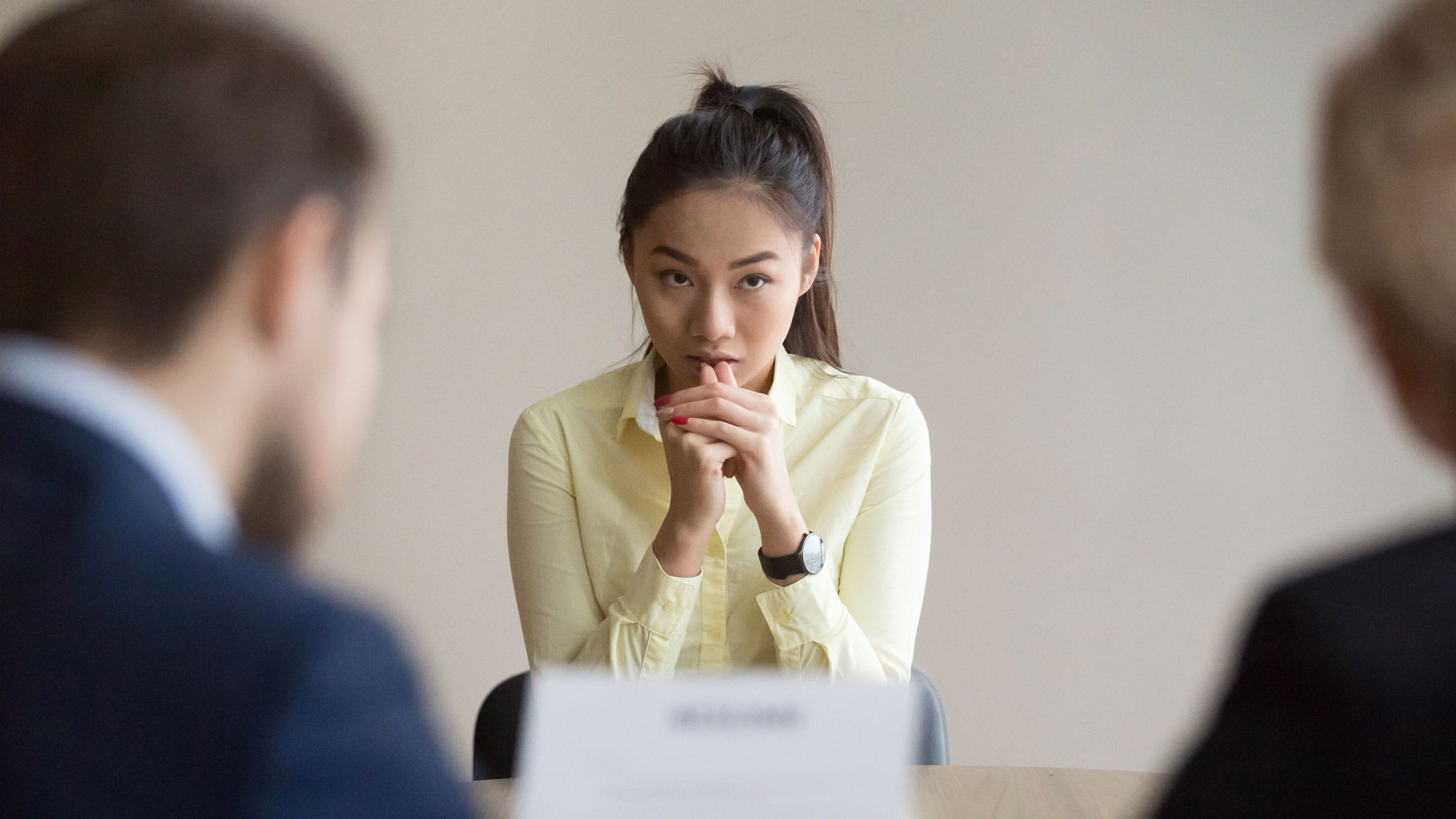 Nervous young job applicant looking stressed at job interview