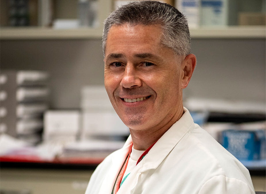 Vadim Fedorov, PhD smiling in the lab