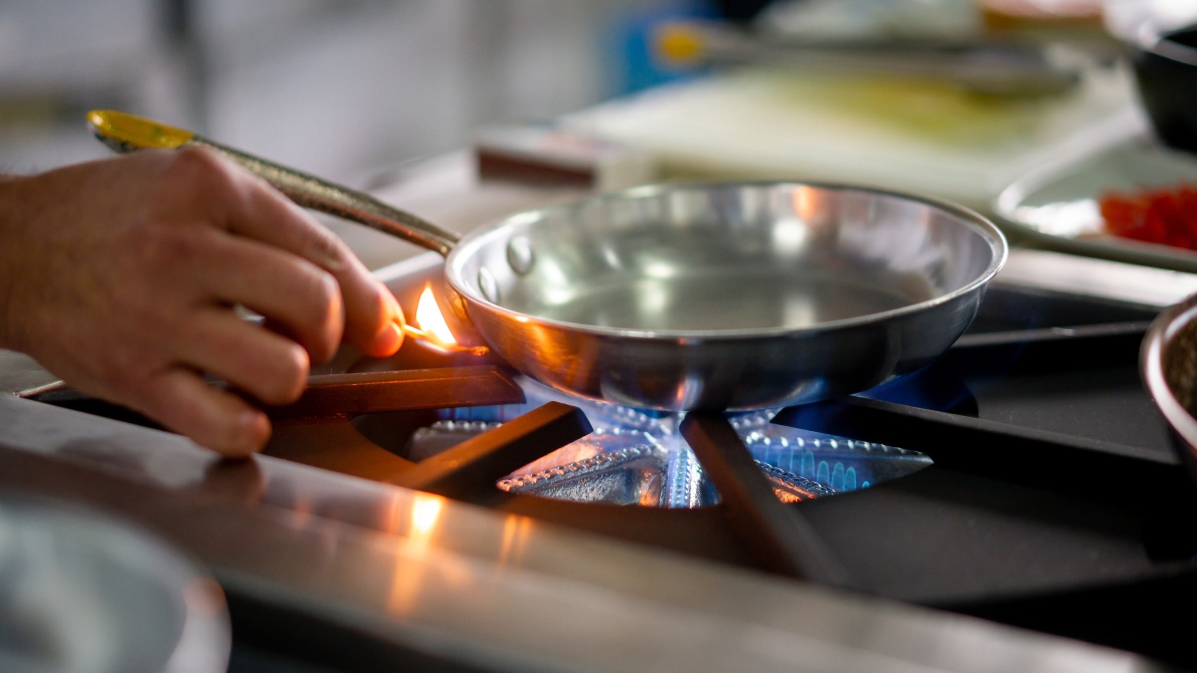 Lighting the stove with a match