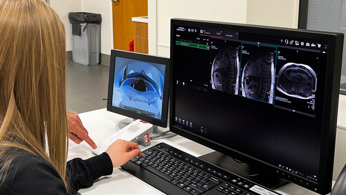Technician reviewing a cardiac MRI scan