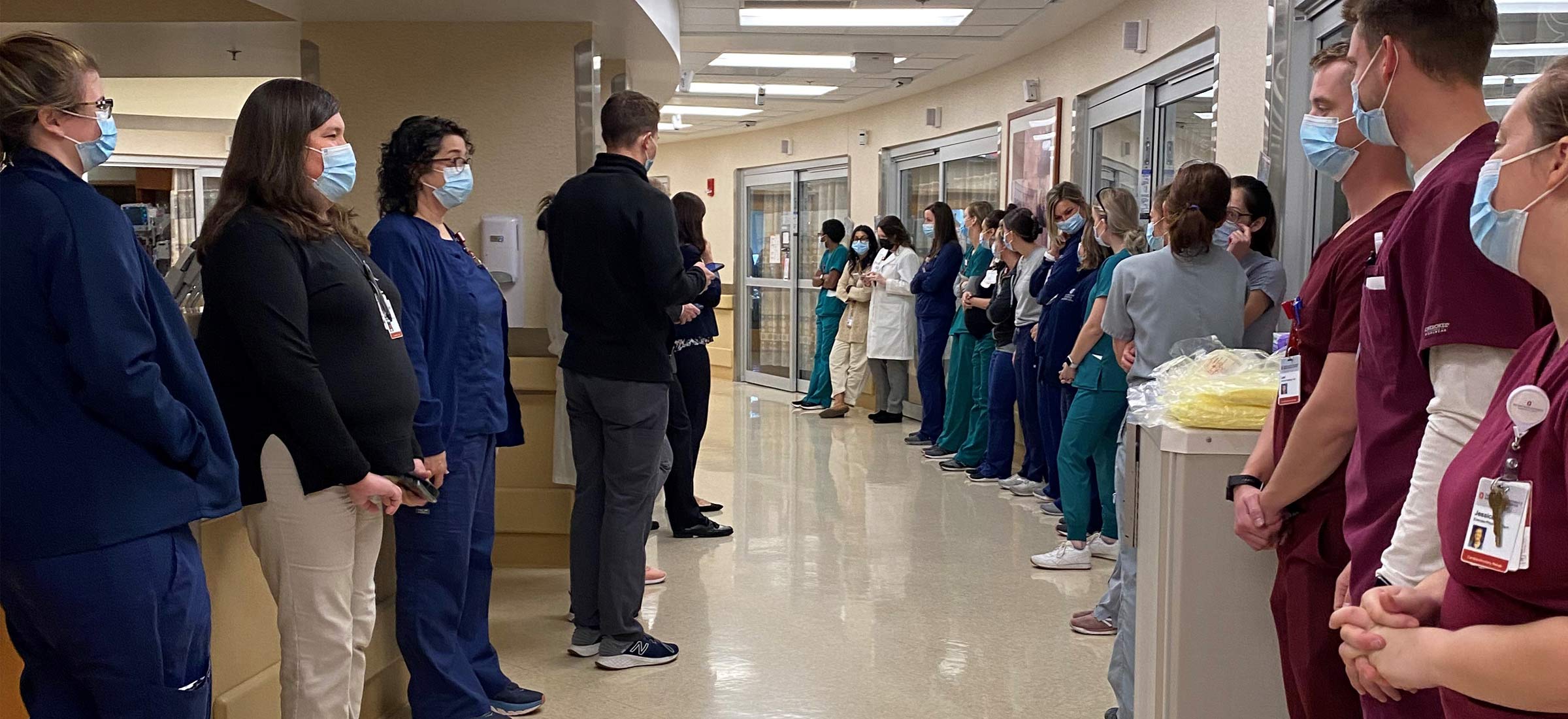 Gigi's care team waiting in the hallway at the Ross Heart Hostpital