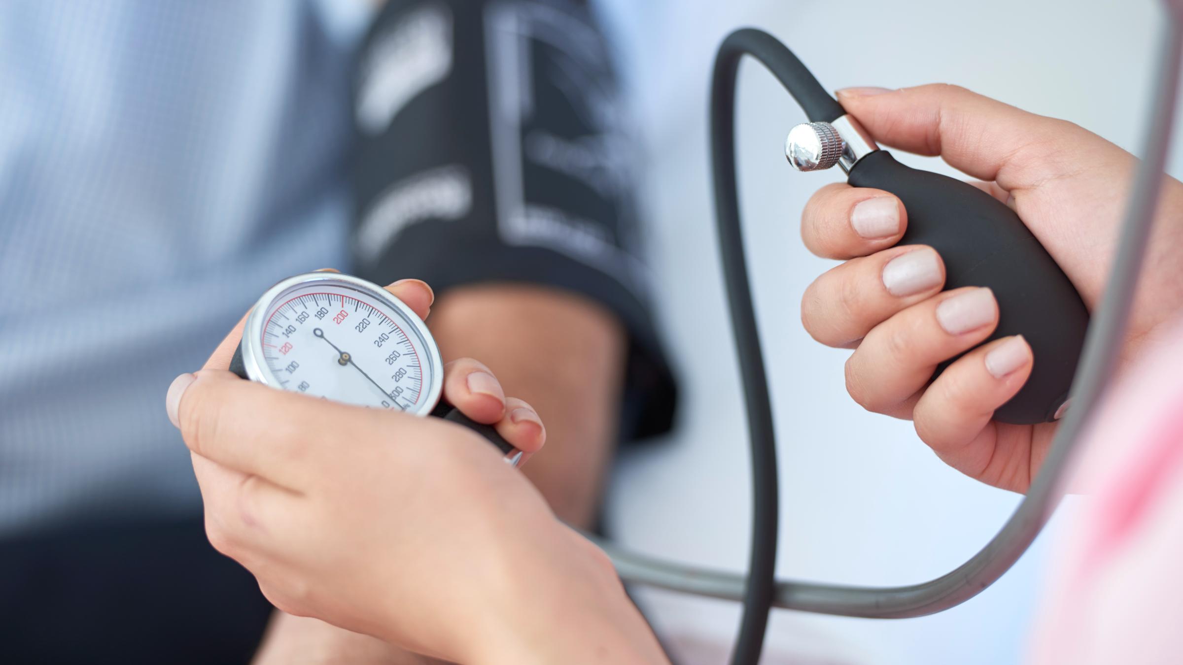 Nurse measuring a patient's blood pressure