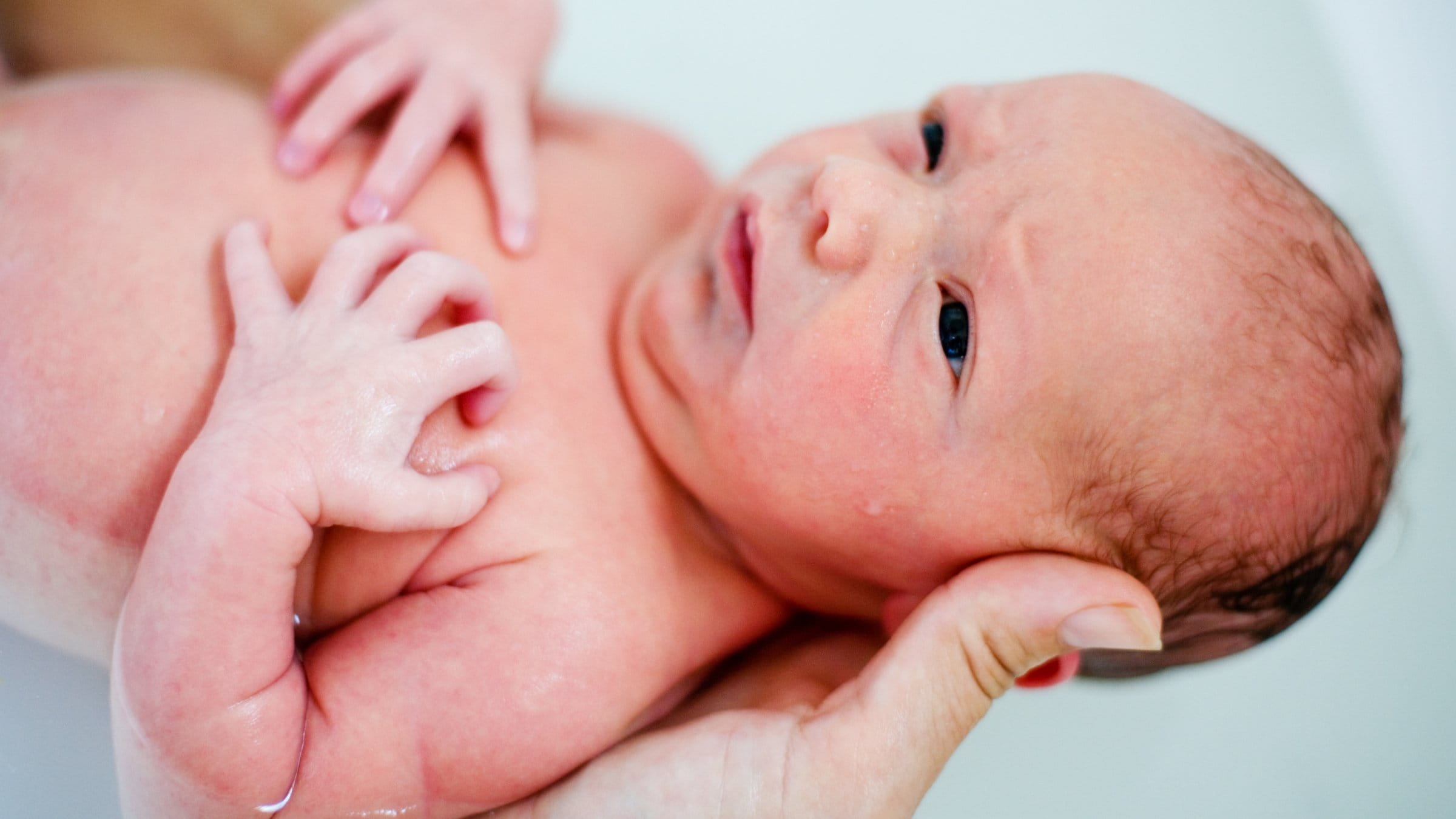 Newborn in water