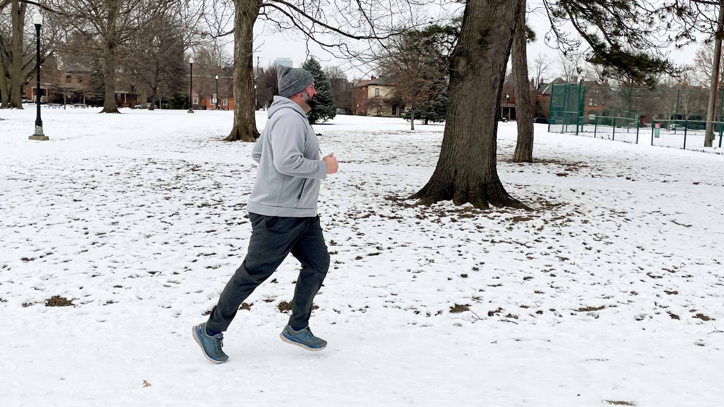 Jordan Hoewischer running outside in the snow