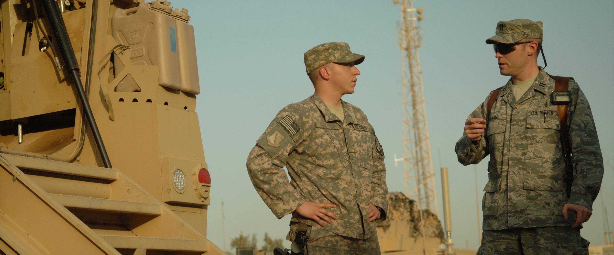 Craig Bryan talking to another member of the military in Iraq