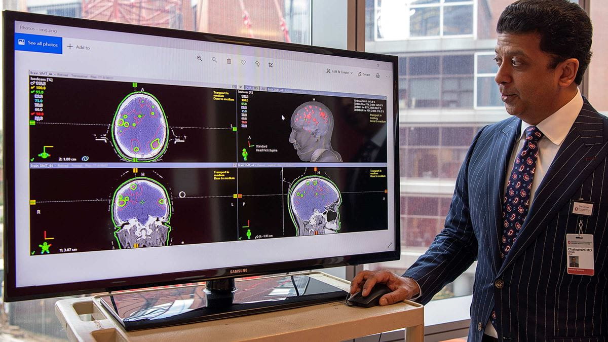 Dr Chakravarti looking at the screen