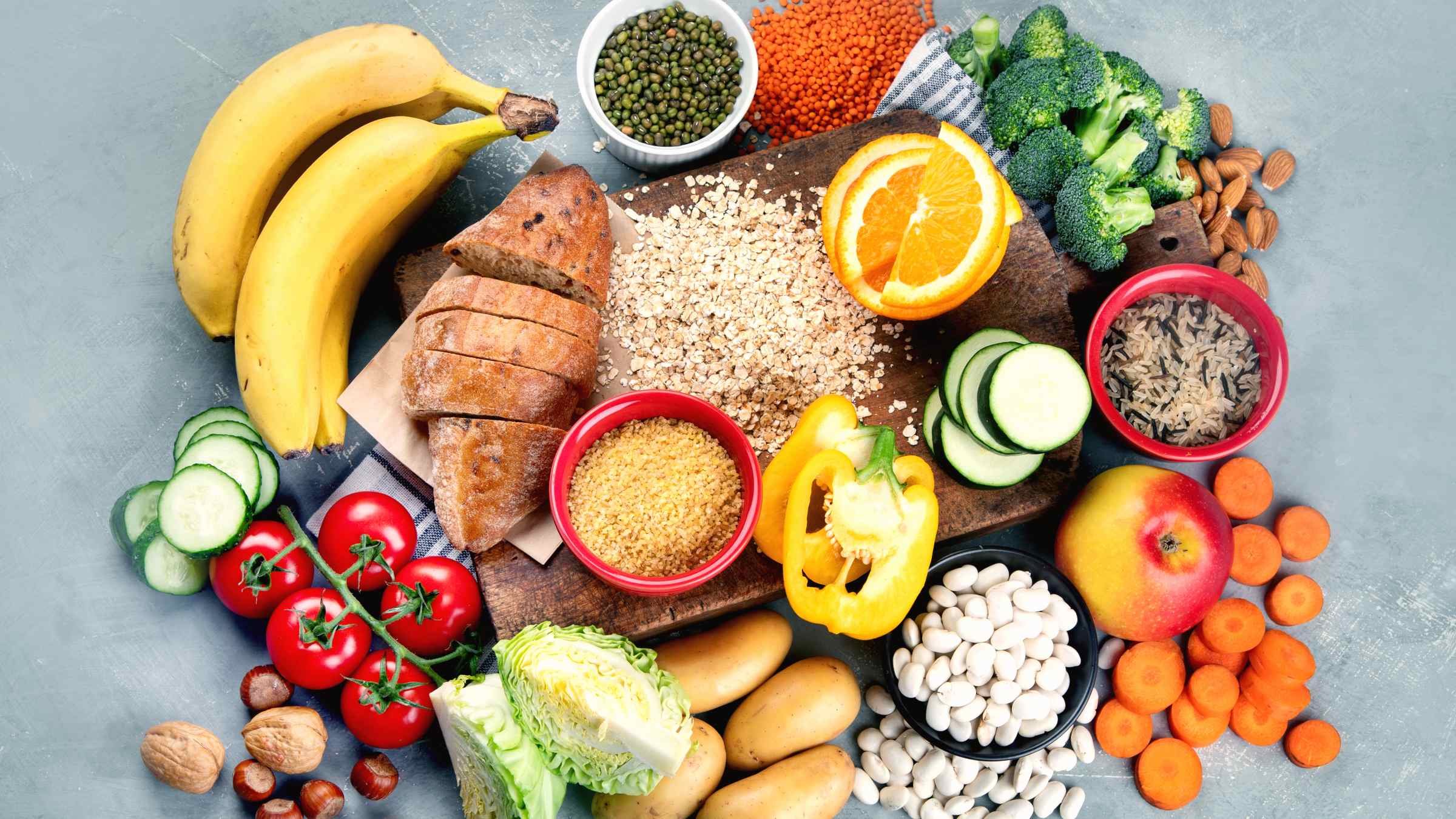 Healthy food lying on the table: vegetables, fruits, whole grains