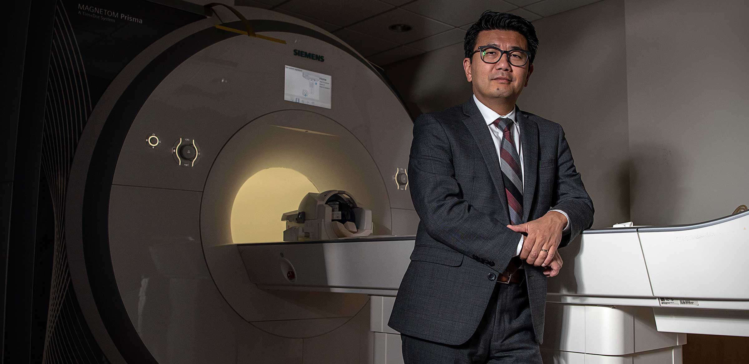 Dr. Phan with brain scanning machine