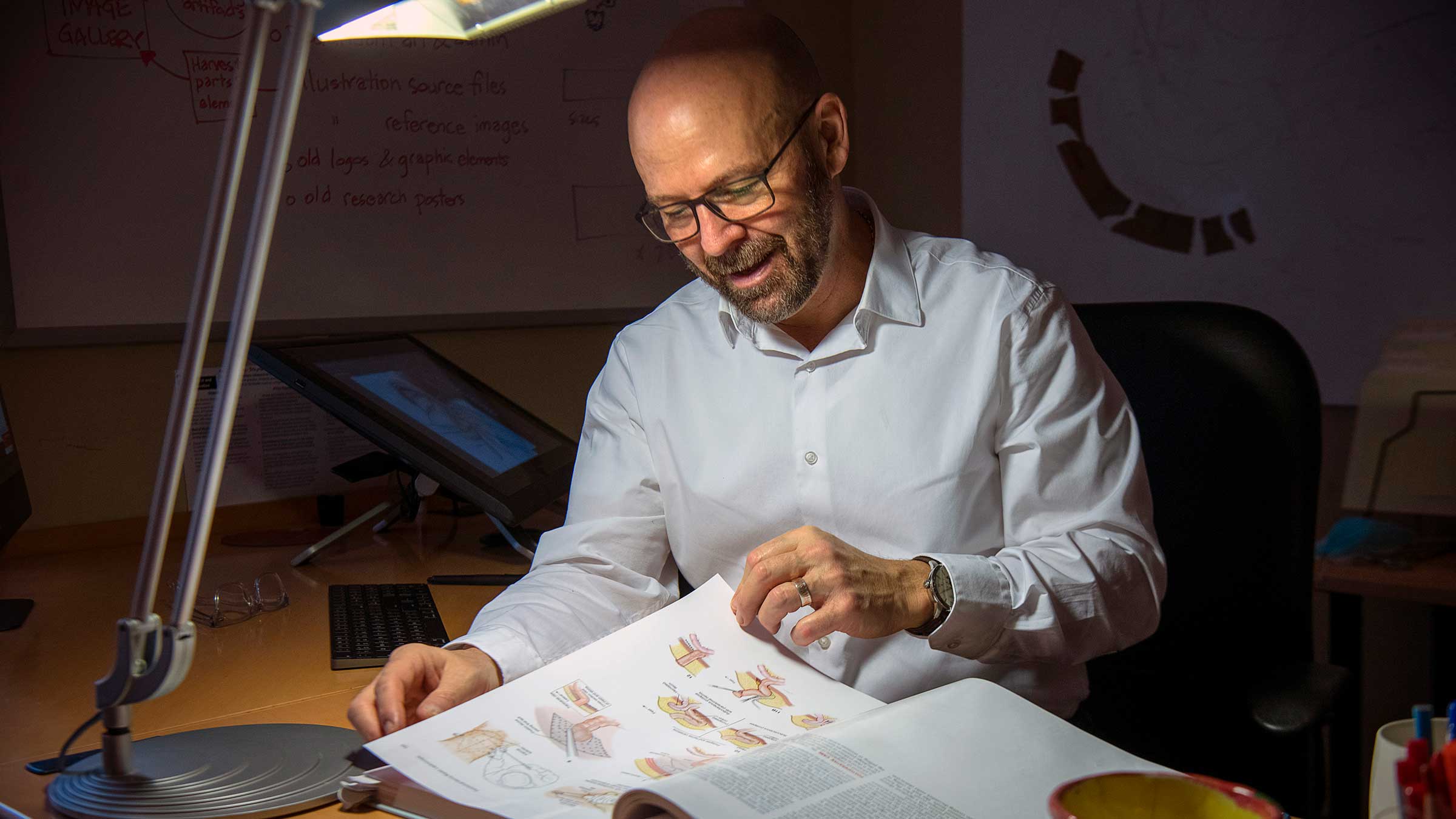 Anthony Baker with his medical illustrations for Zollinger's Atlas