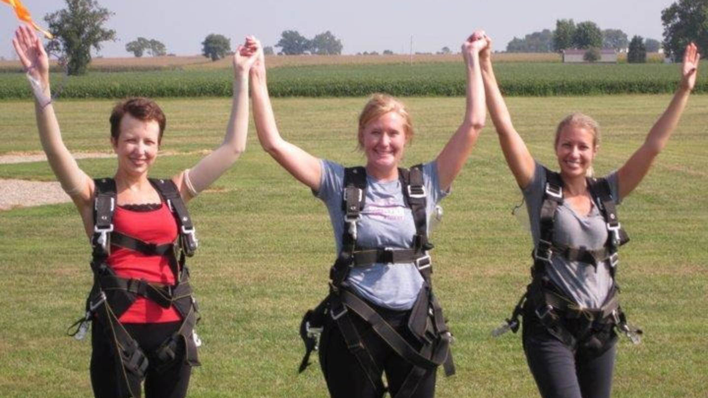Lori Gill Grennan and friends cheering after skydiving together