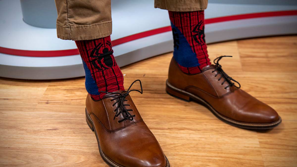 Nurse Phil Re showing his socks with Spiderman design
