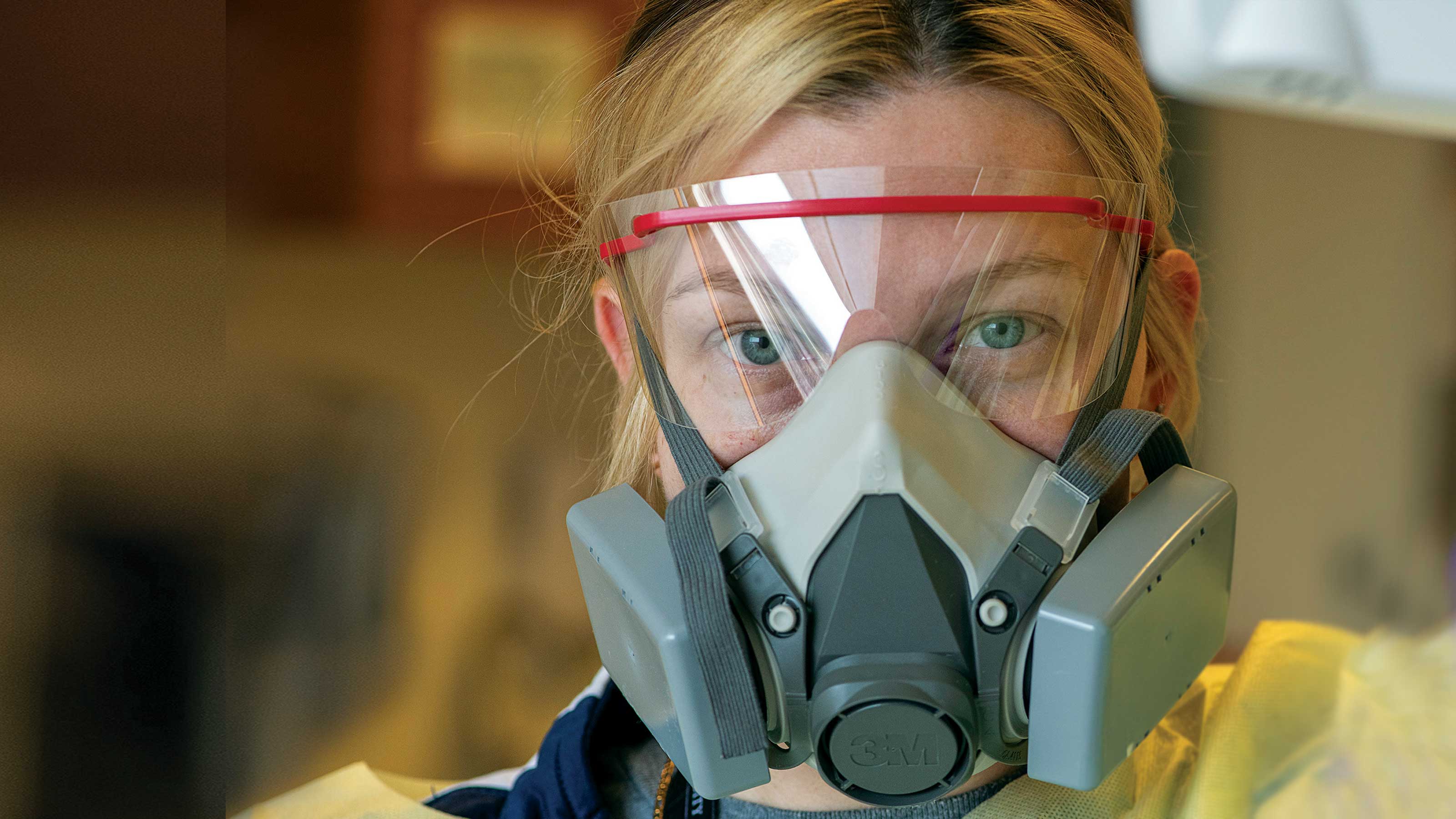 Ohio State health care worker wearing PPE and a respirator