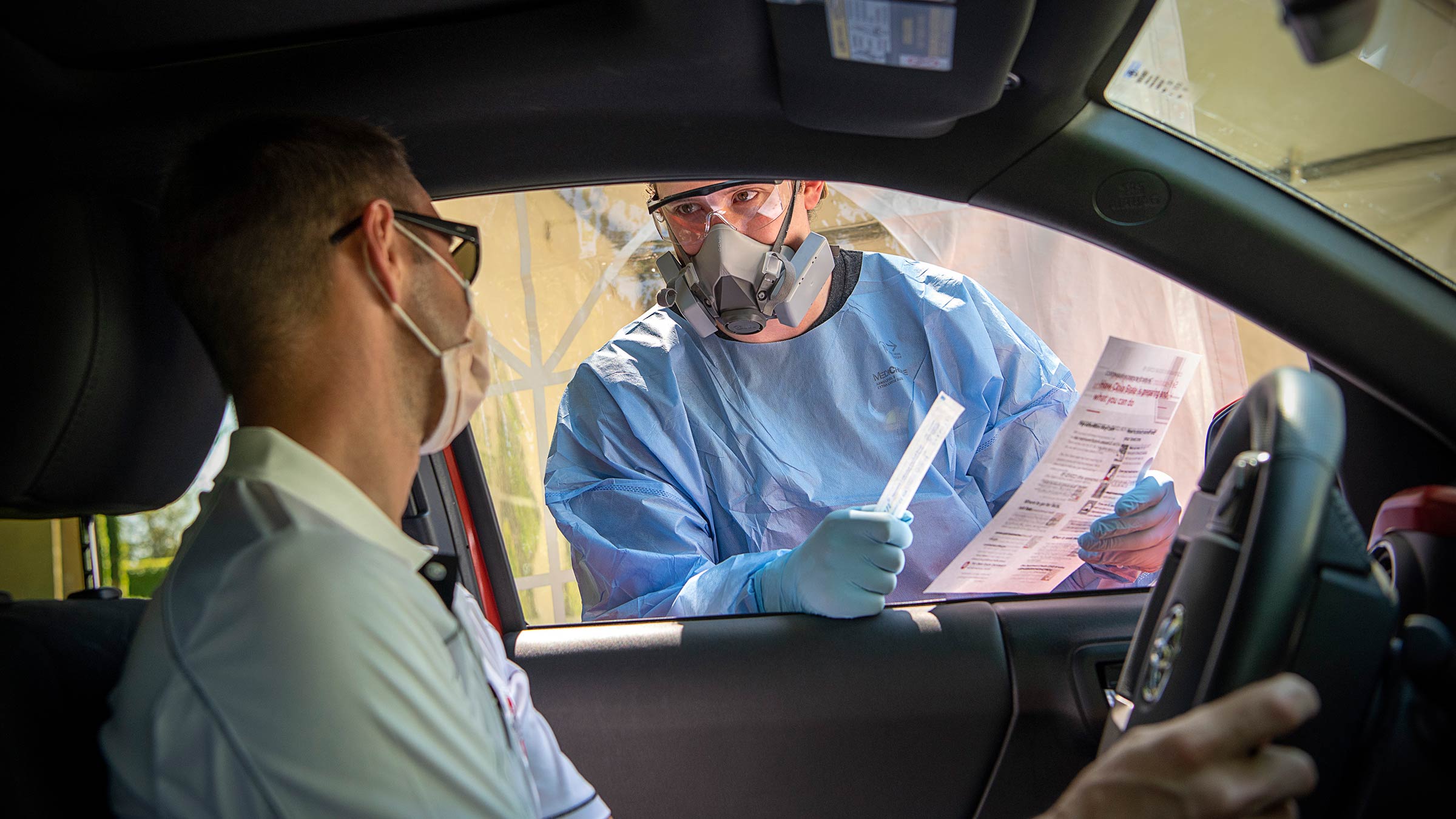Patient waiting in his car for a COVID-19 test at a drive-through testing site