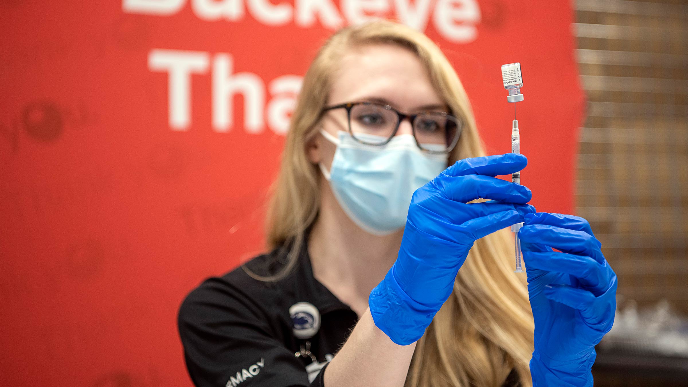 An Ohio State pharmacist prepares a COVID-19 vaccine