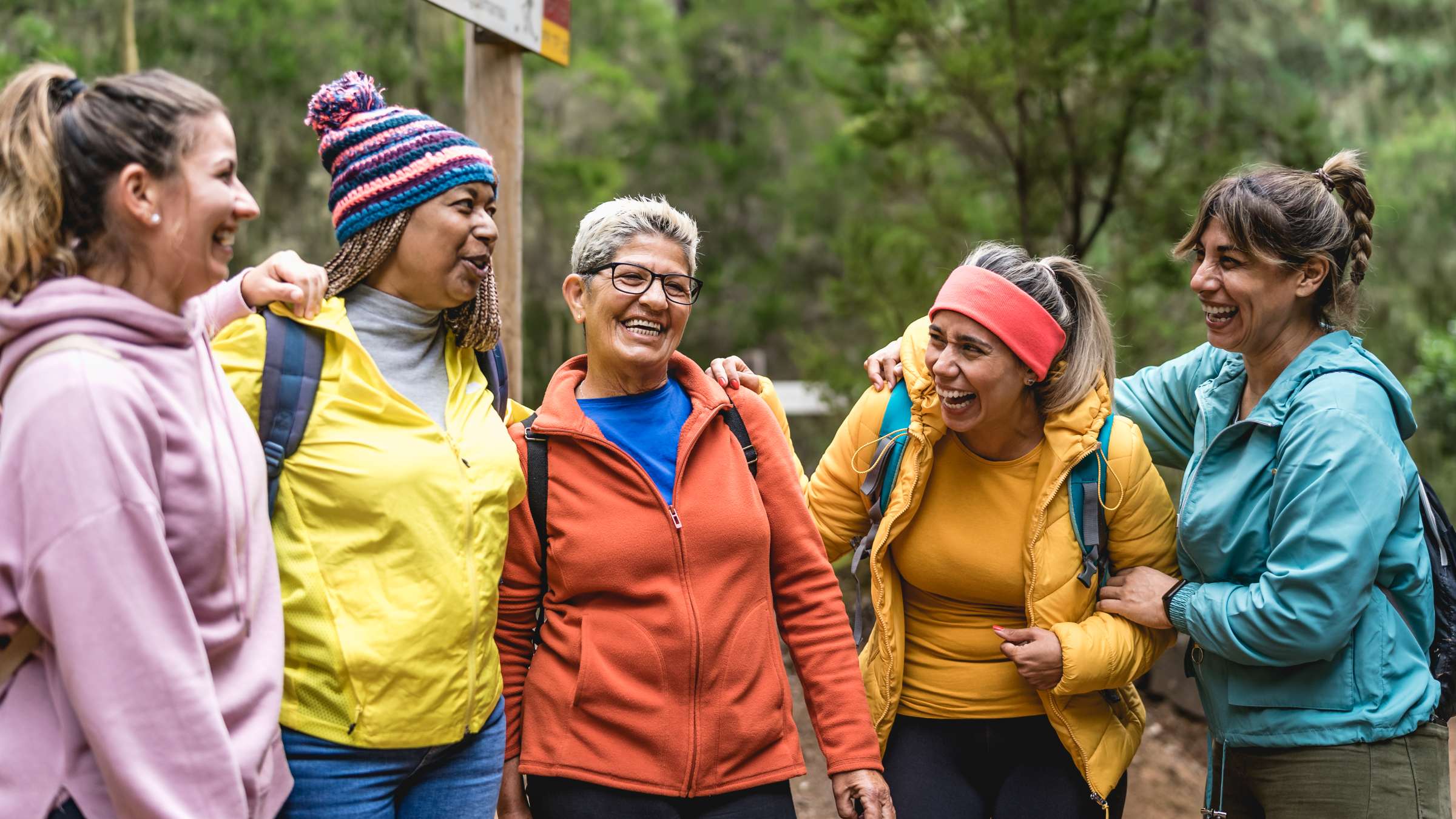 Five women hiking in a park