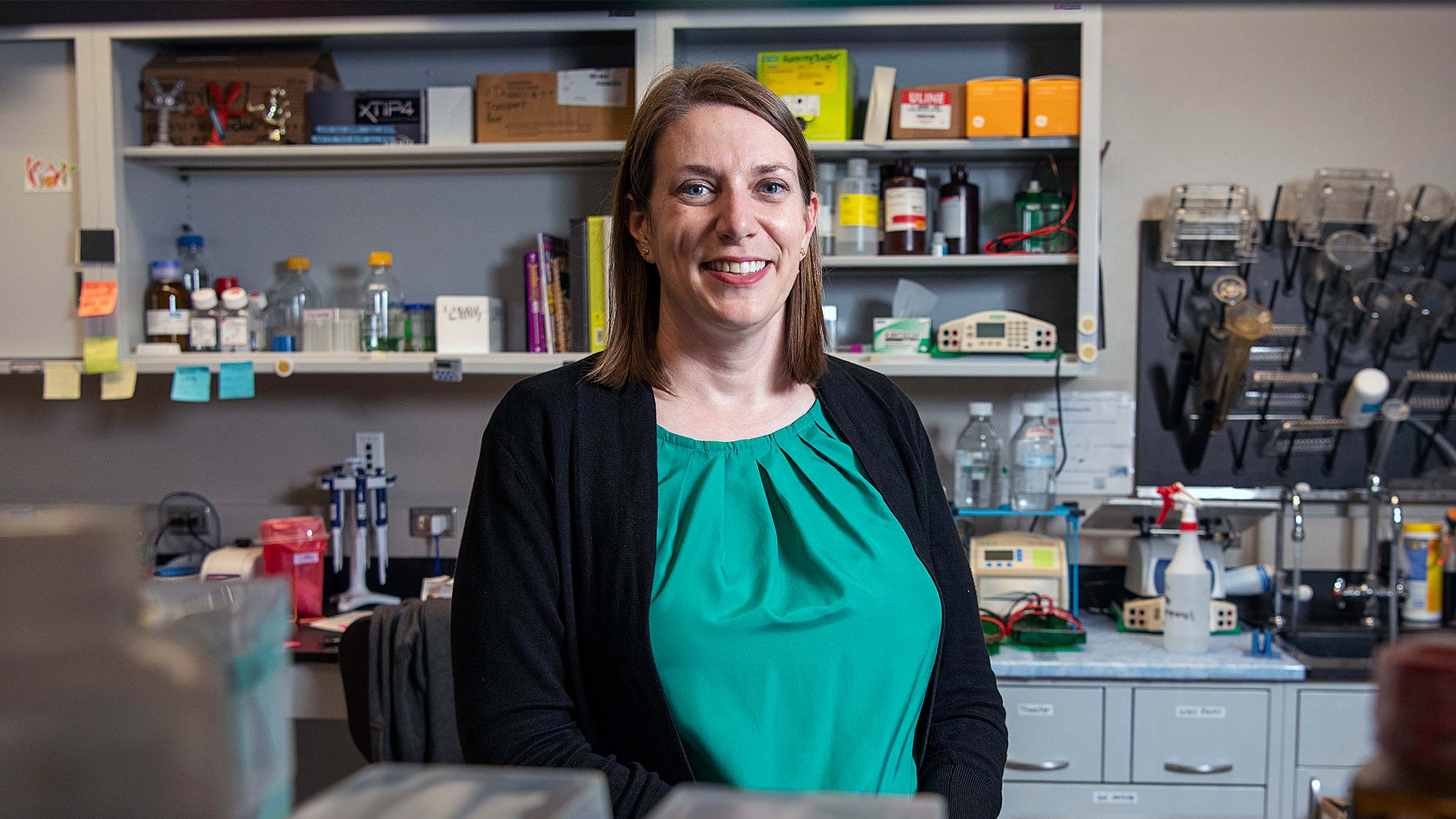 Cancer researcher Jennifer Woyach, MD, standing in her lab