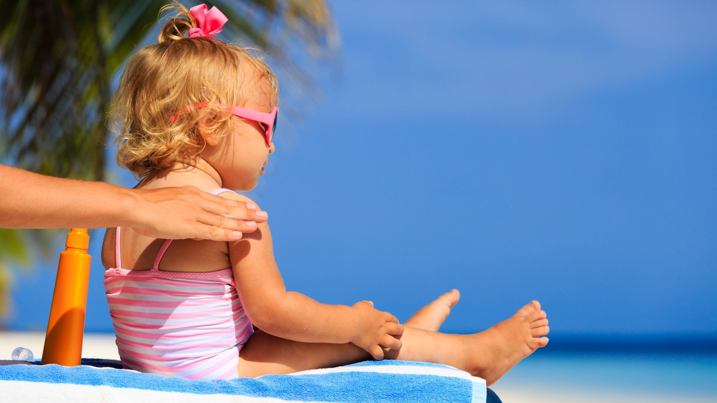 Applying sunscreen on a baby