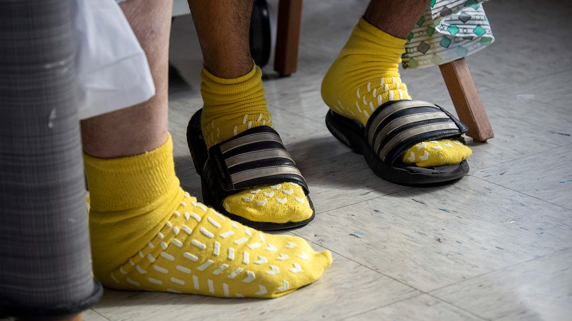 Josh and Jonathan's feet wearing hospital socks after their kidney transplant procedures at Ohio State Medical Center