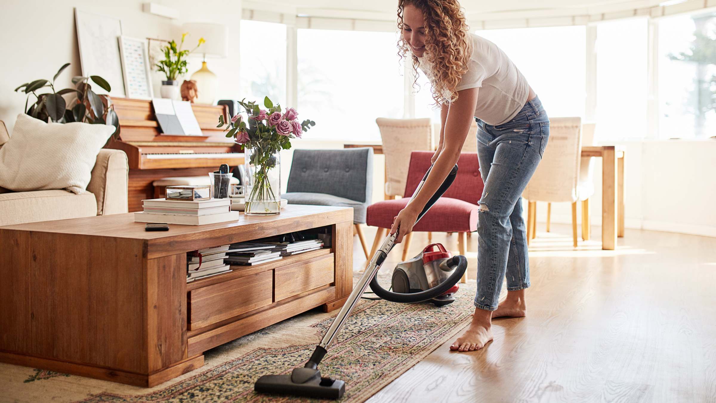 Woman vacuuming her living room