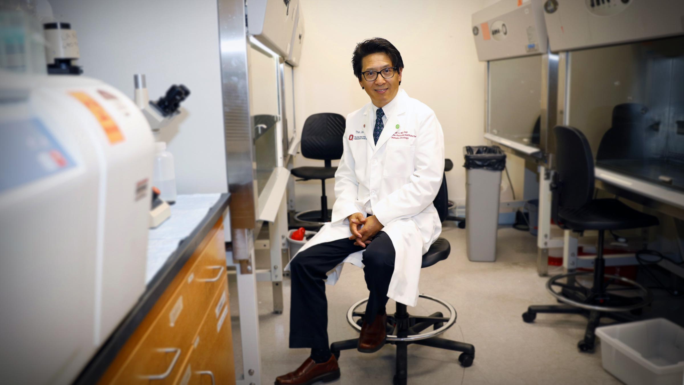 Zihai Li, MD PhD sitting in his lab at Ohio State