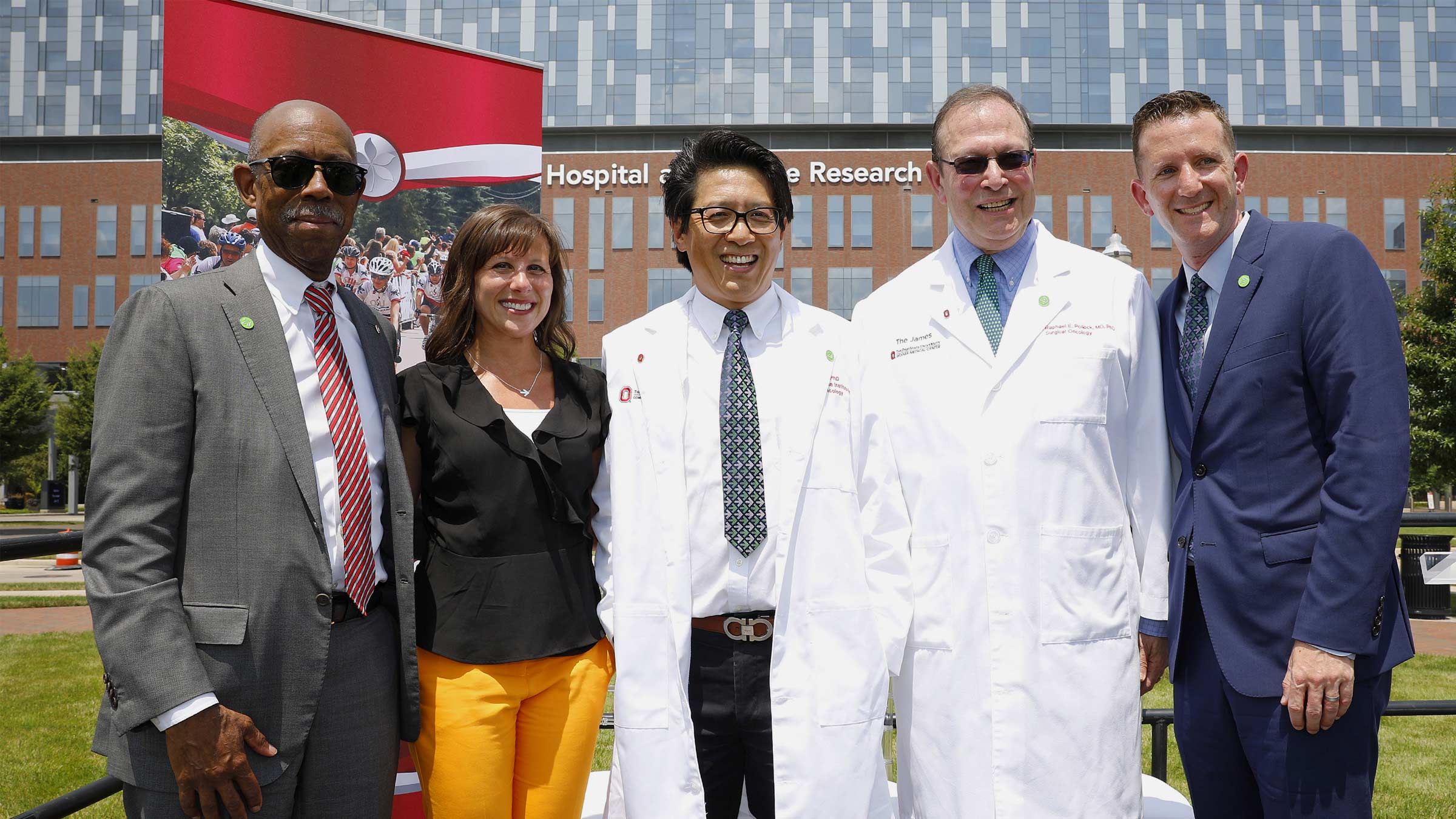 Zihai Li, MD, PhD with a group of Pelotonia board members outside of the James Cancer Hospital