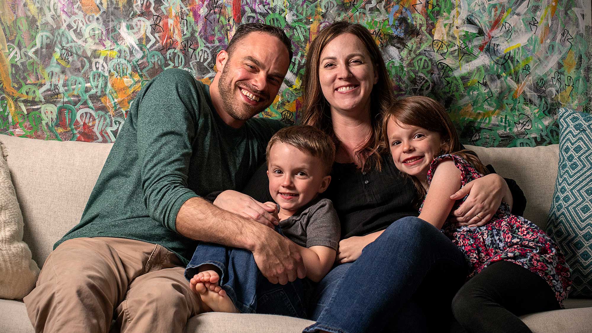 AJ Heckman with his wife and their two children