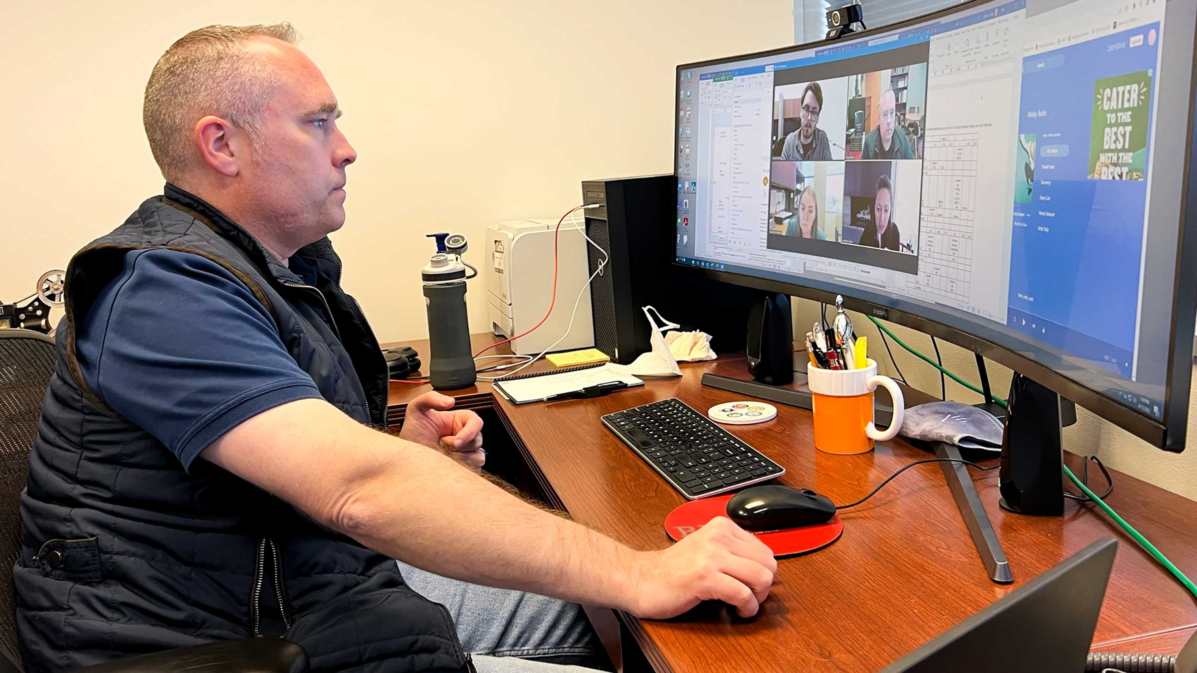 Dr. Bryan on a video conference with his colleagues