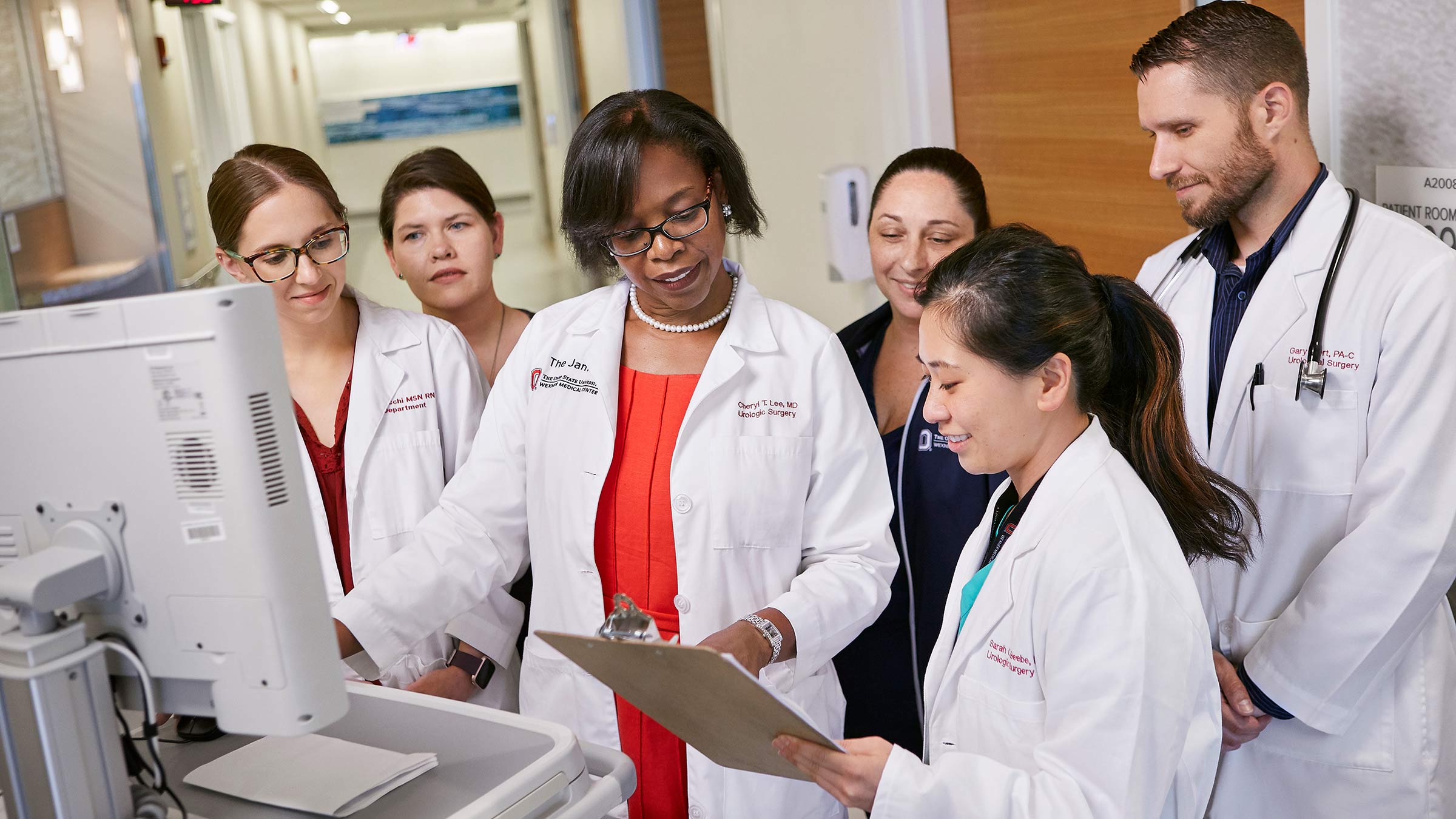 Cheryl Lee, MD, surrounded by young doctors