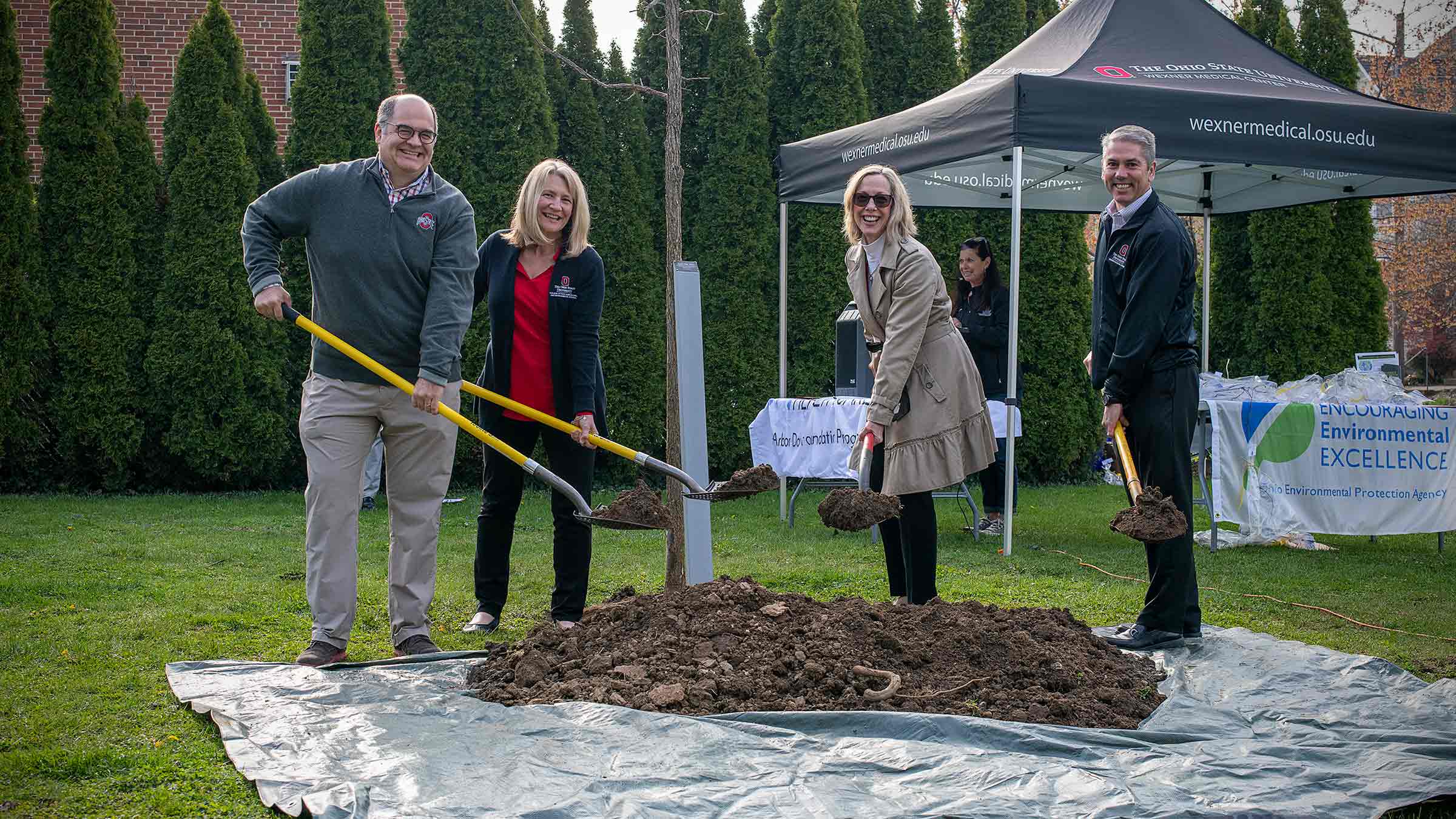 Planting a tree in a 2022 Earth Day celebration