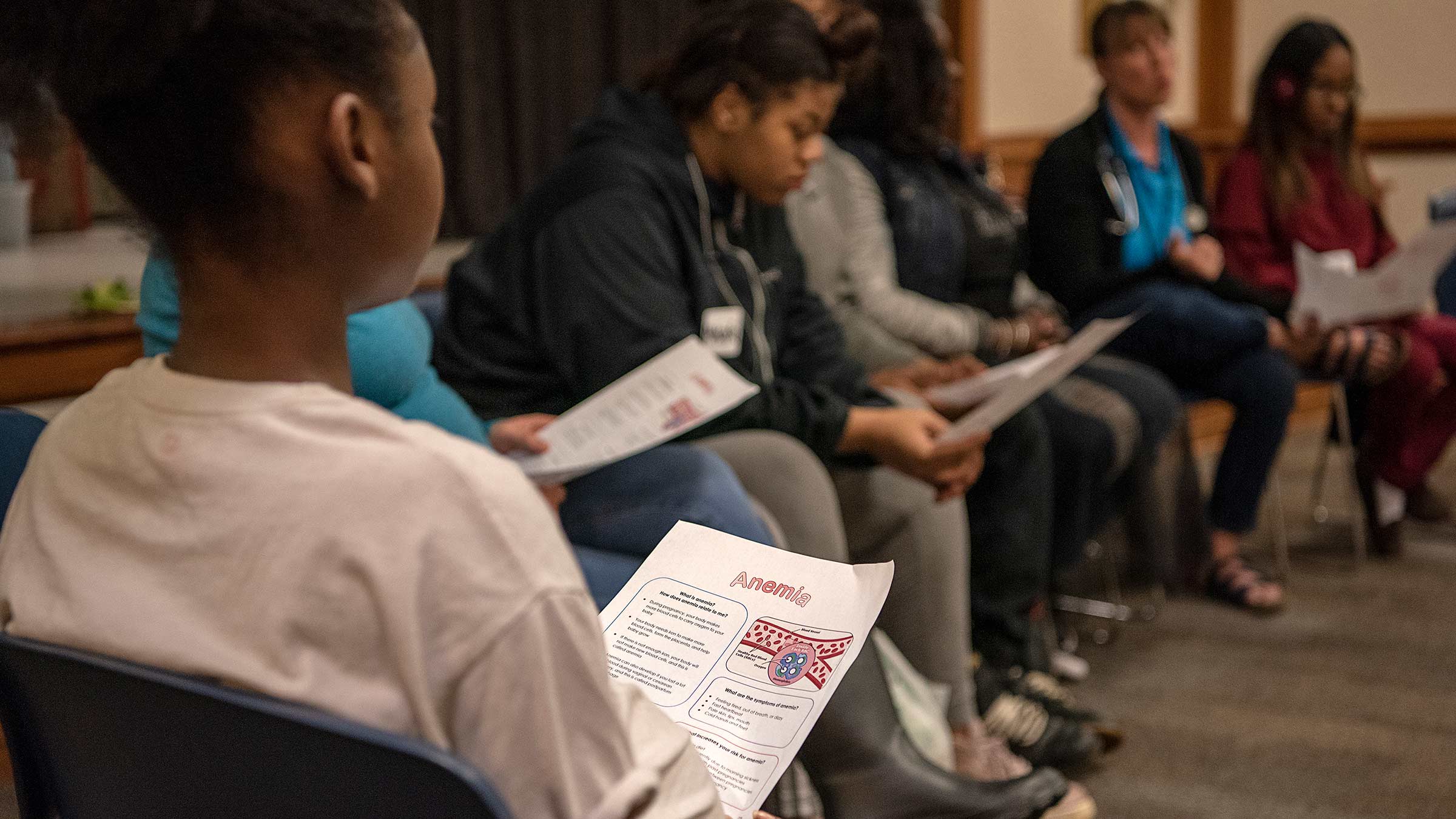 Women attending an educational session