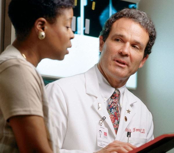 Dr. Farrar with a patient