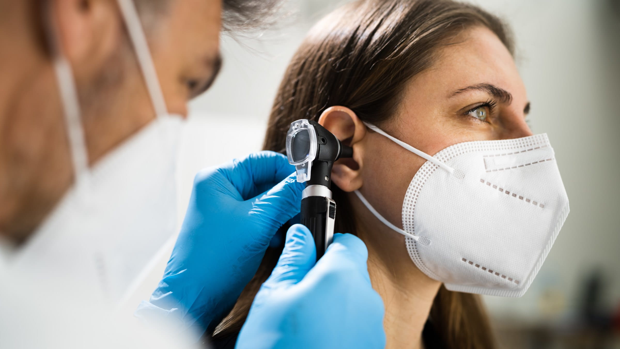 Doctor examining a patient's ear