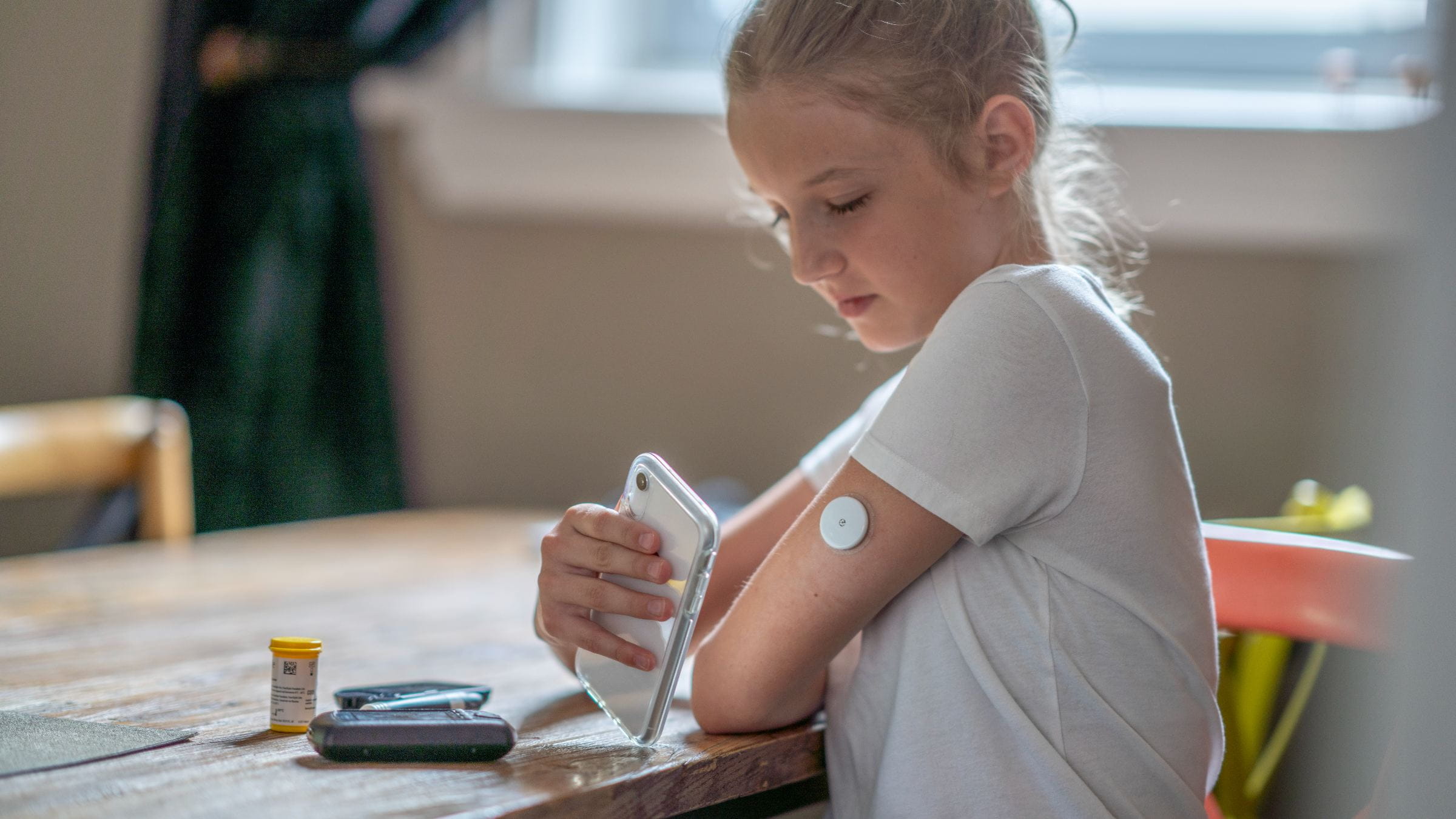 Girl measuring her blood sugar level