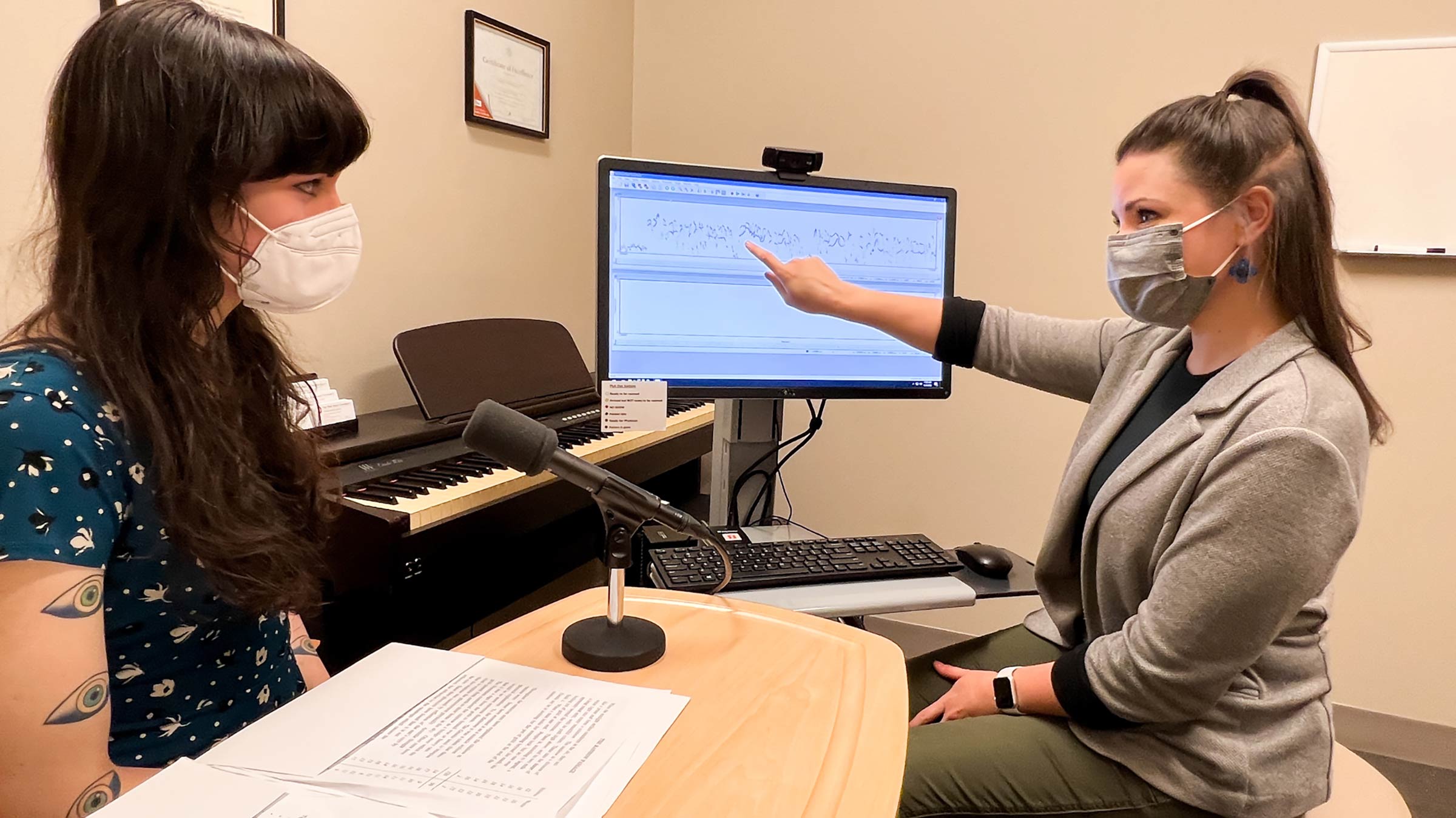 Voice therapy specialist working with a patient