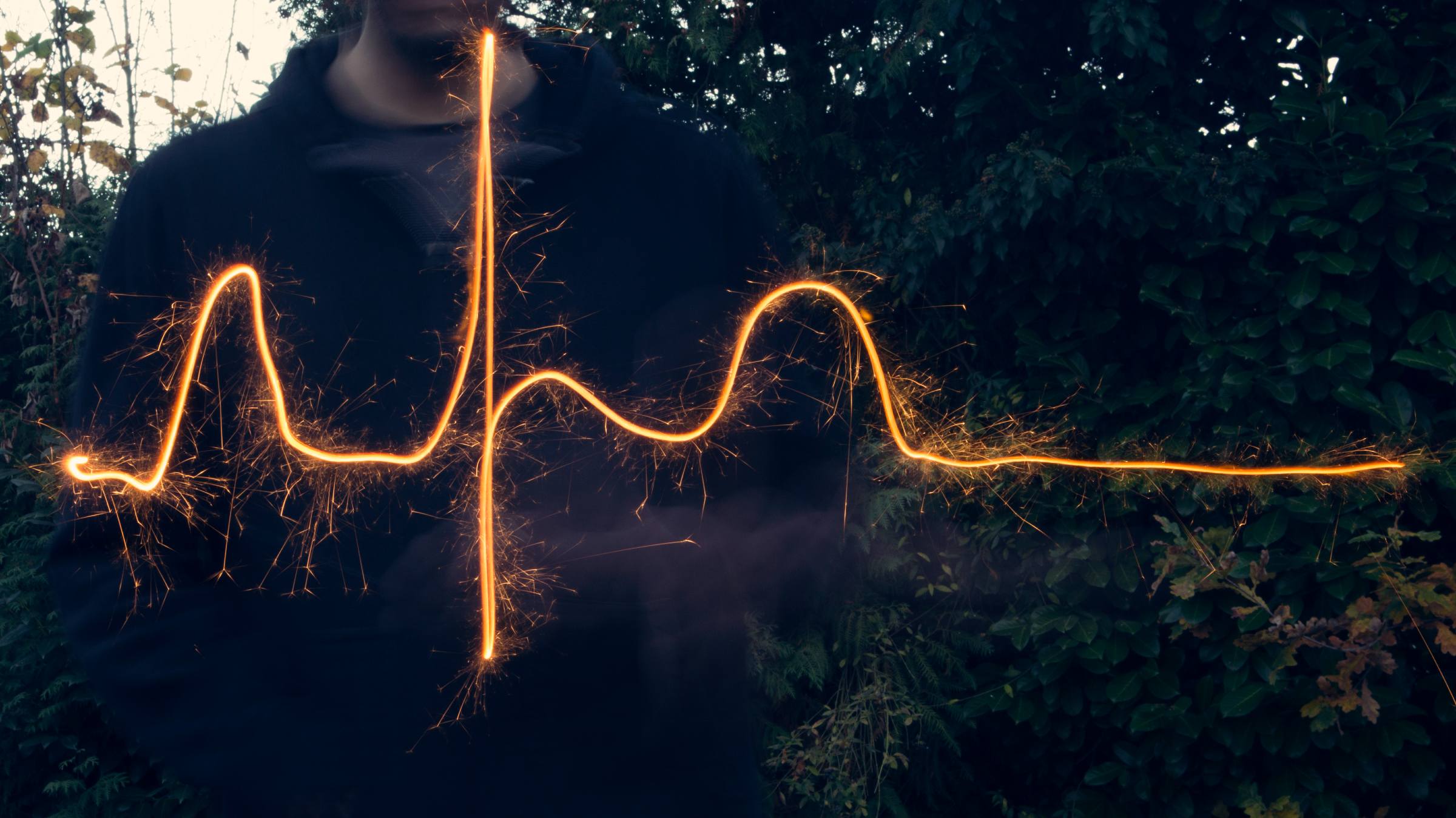Heart rhythm line drawn out in the dark with a sparkler