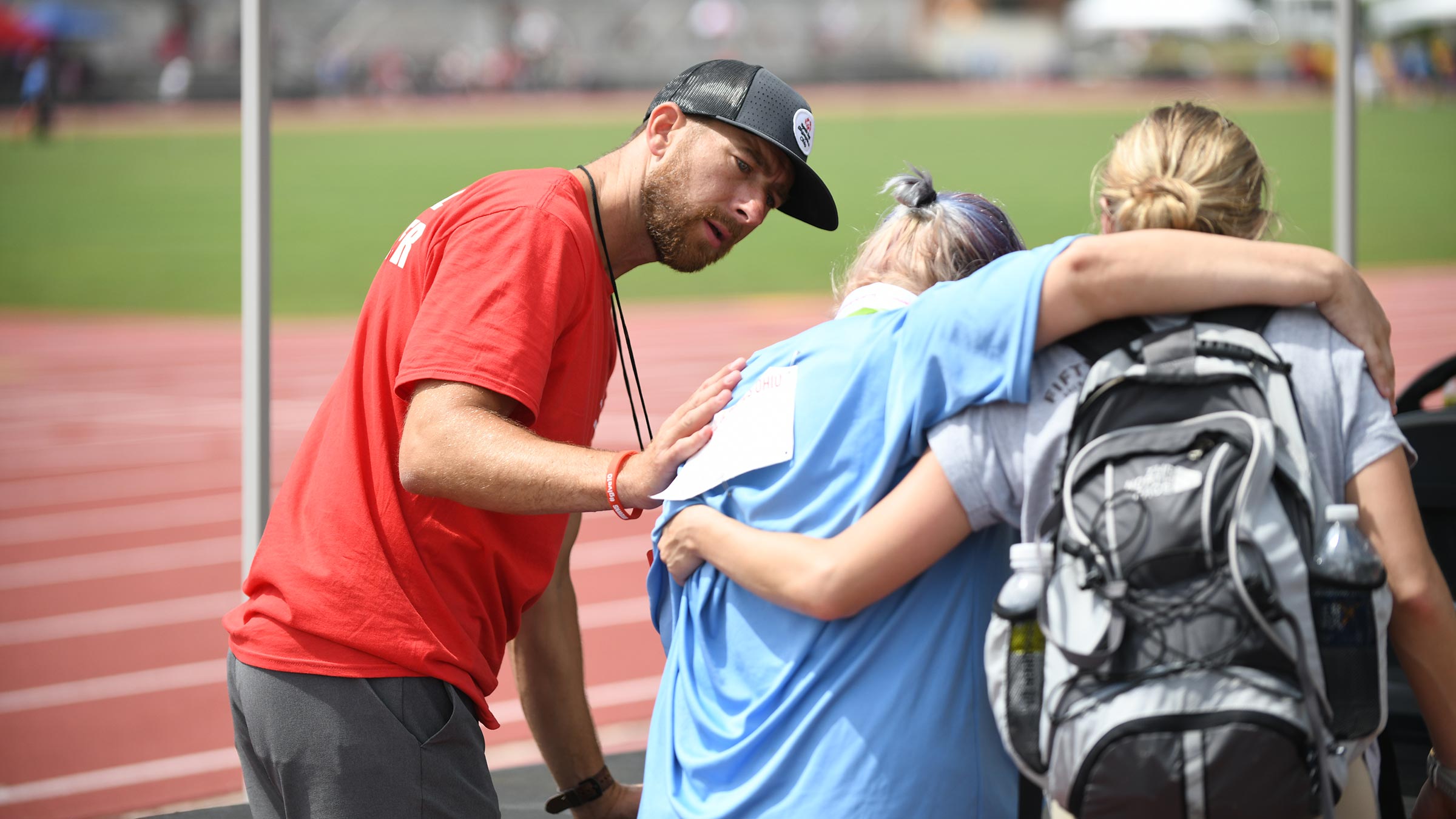 Michael Jonesco helping an athlete