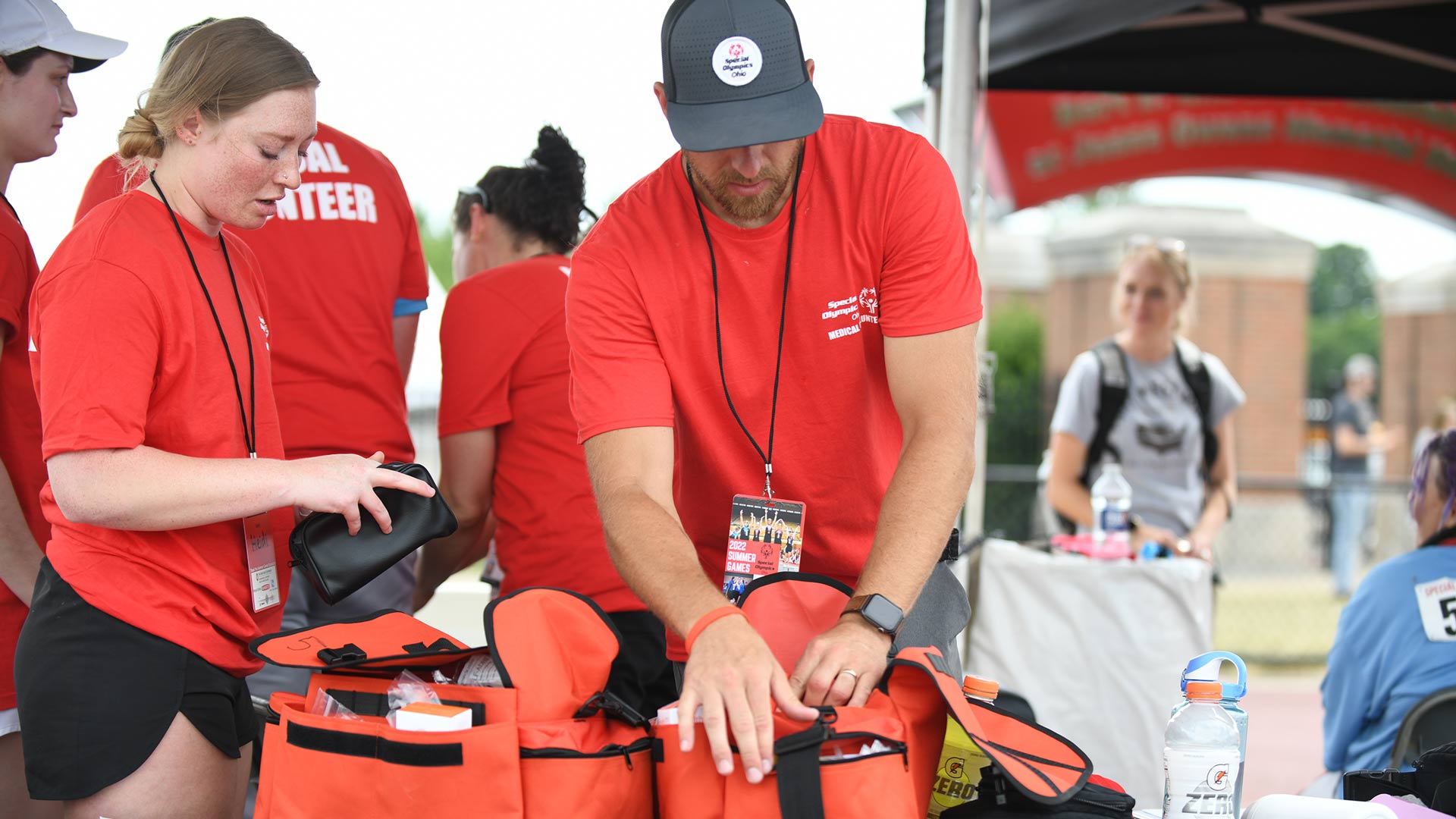 Medical volunteers preparing first aid bags