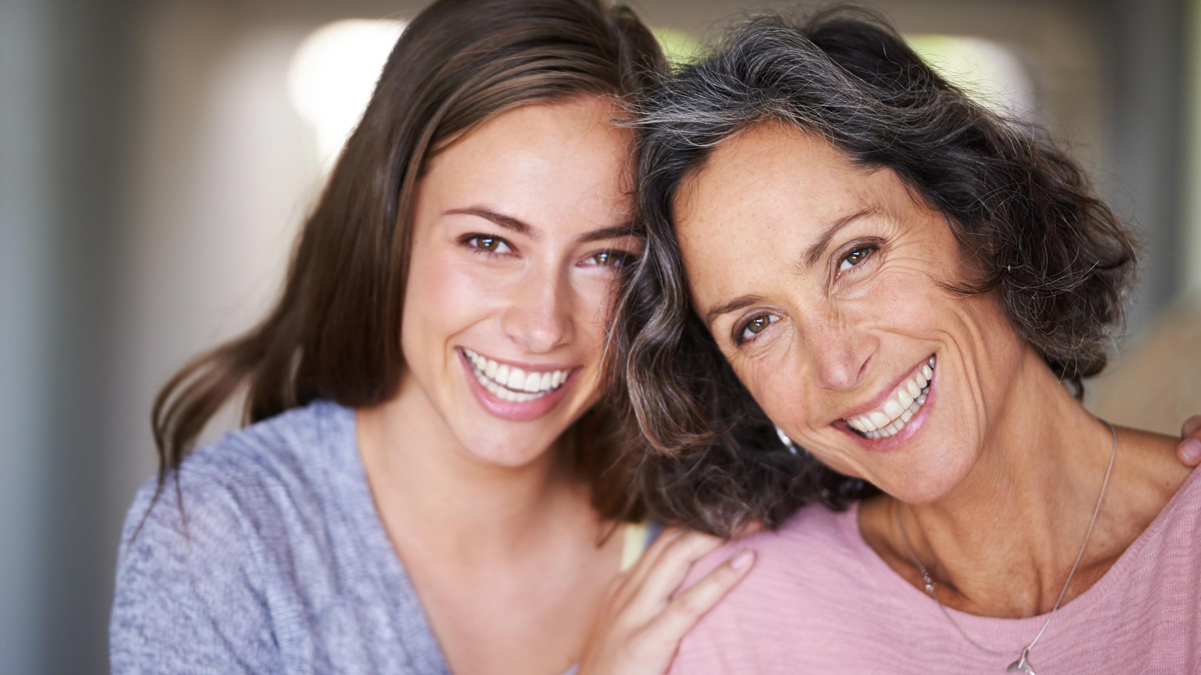 Mother and daughter laughing