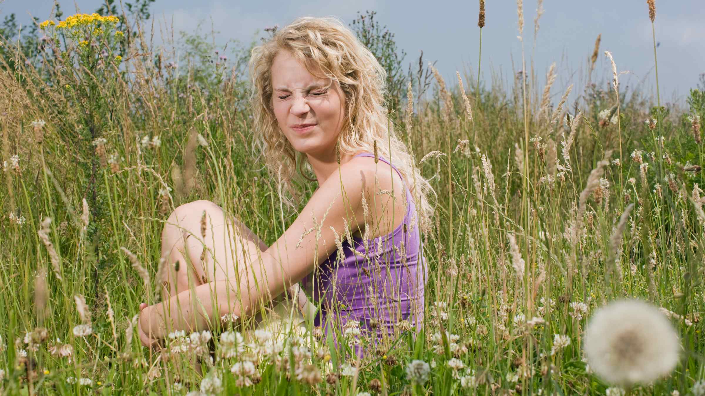 Woman sitting in the meadow